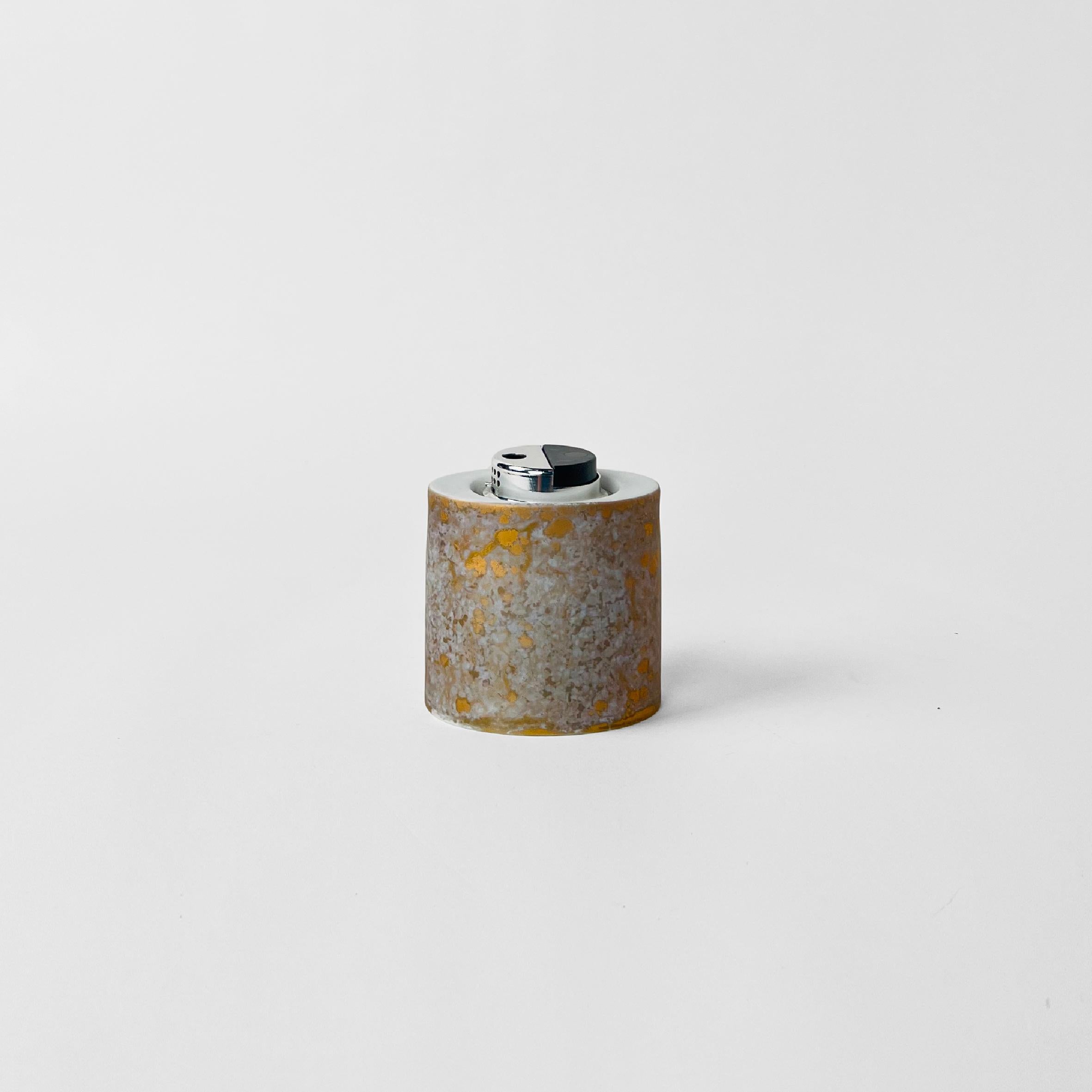 Table lighter with light grey and golden pattern. Designed by H. Drexler for Rosenthal. Made in Germany, circa 1970.