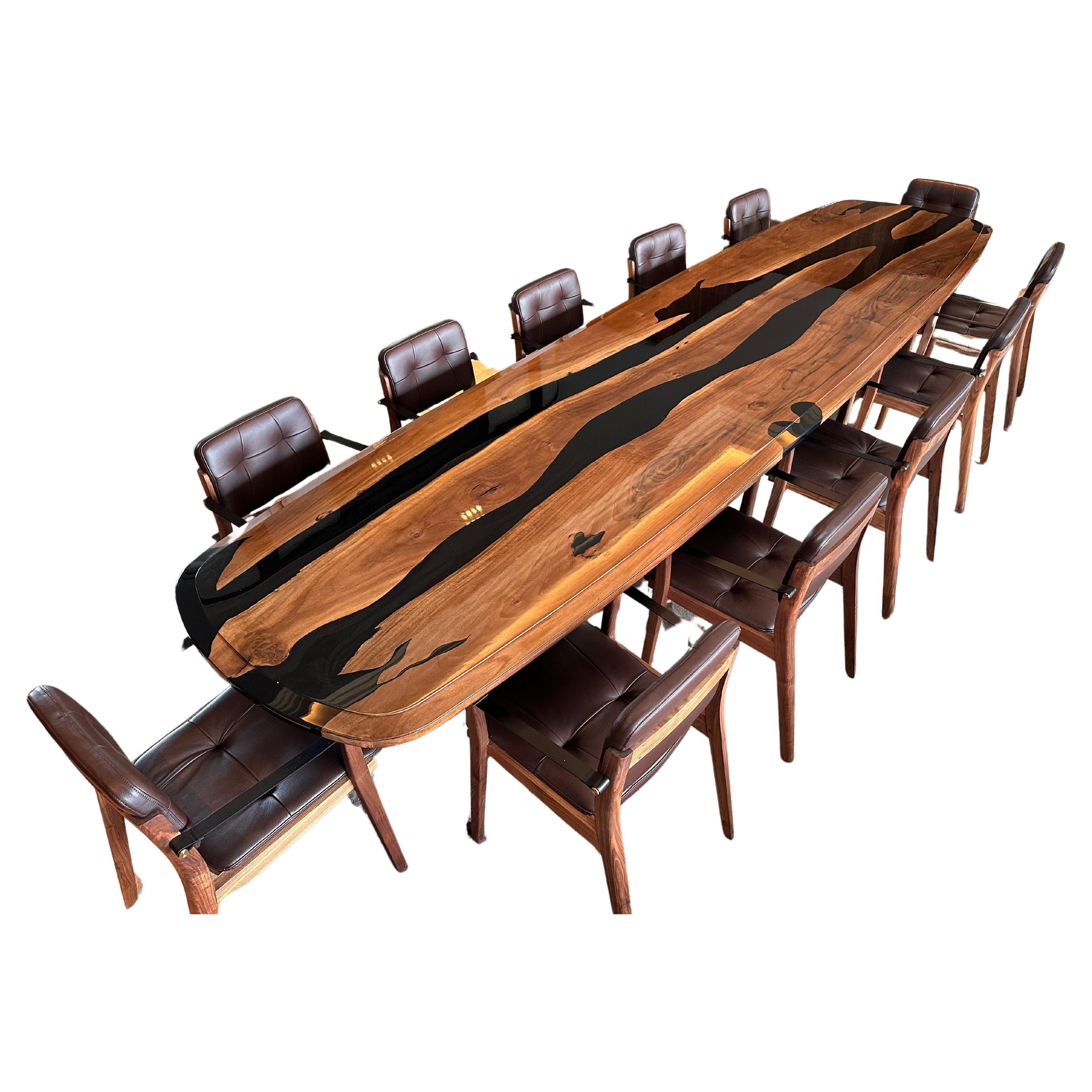 Very large dining table, 4m25 long, in American Walnut with dark blue/black resin inlay. 

Ideally for 10 to 12 people.

Table contours treated with a contemporary chamfer with raised edges.

High-gloss polished finish (intense varnish).

Wood base