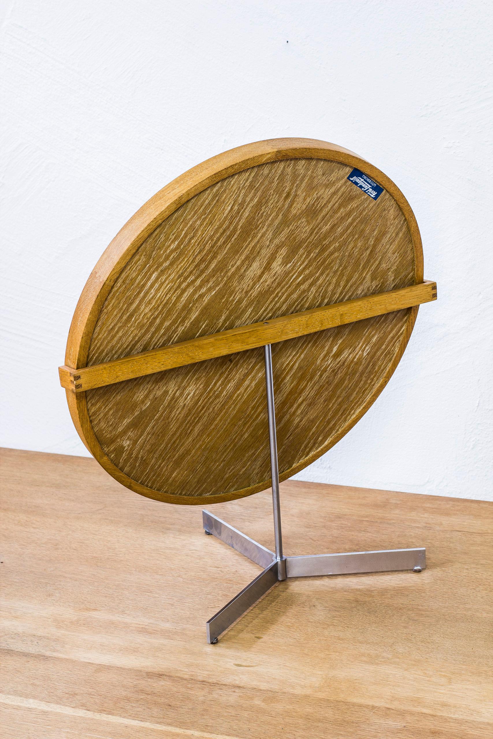 Rare large table mirror designed by Uno & Östen Kristiansson. Produced by Swedish company Luxus during the 1950s. Frame made from solid lime treated oak with leather lining holding the mirror in place. Zipper joinery on the frame and the back piece.