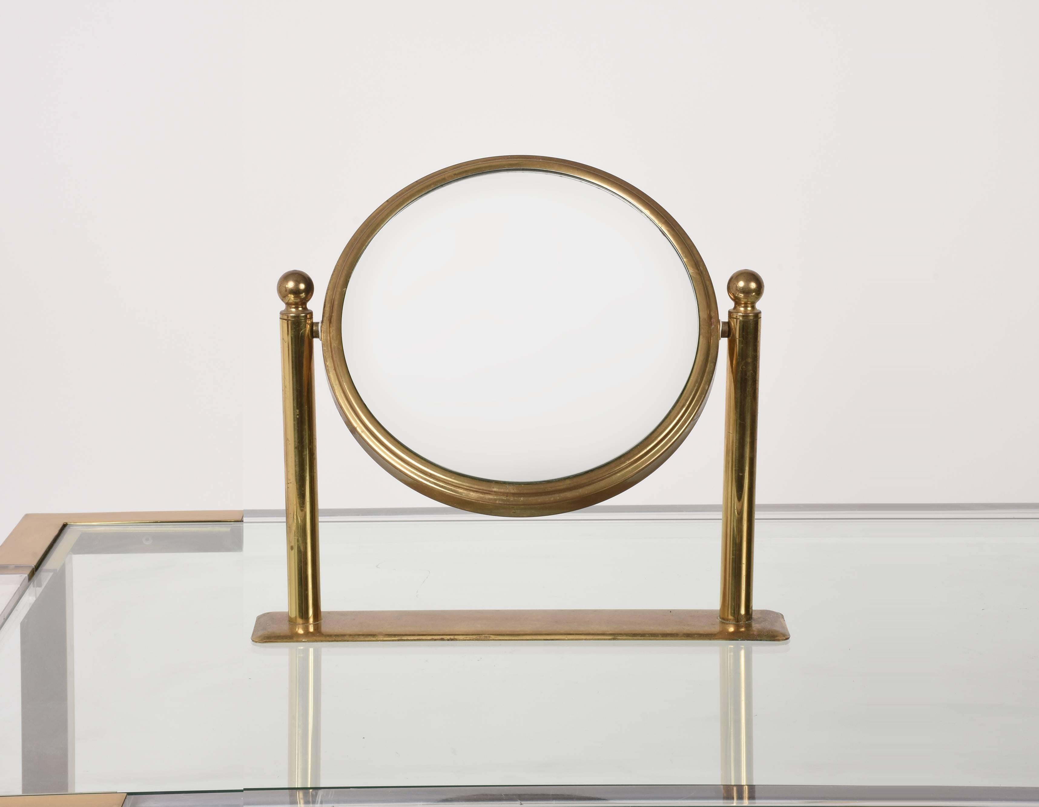 Table mirror in brass. Double-sided vanity. Adjustable and magnified on one side, Italy 1960s.