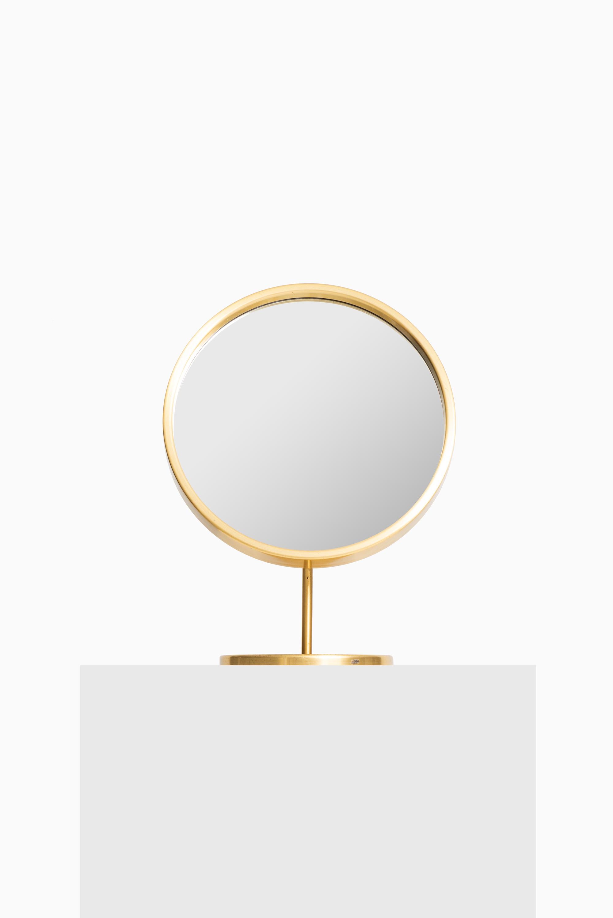 Rare table mirror in brass. Produced by Glas Mäster in Markaryd, Sweden.