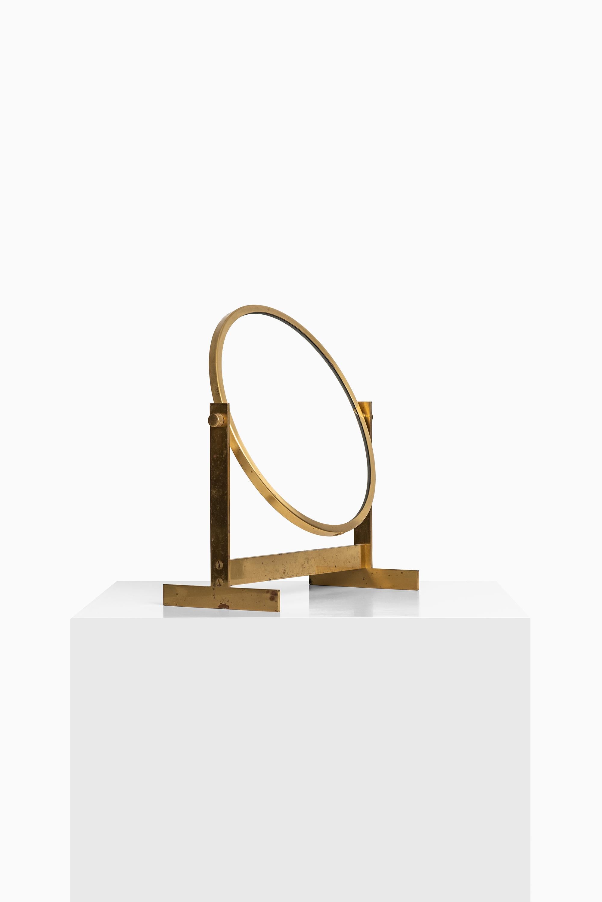 Rare table mirror in brass produced in Sweden.