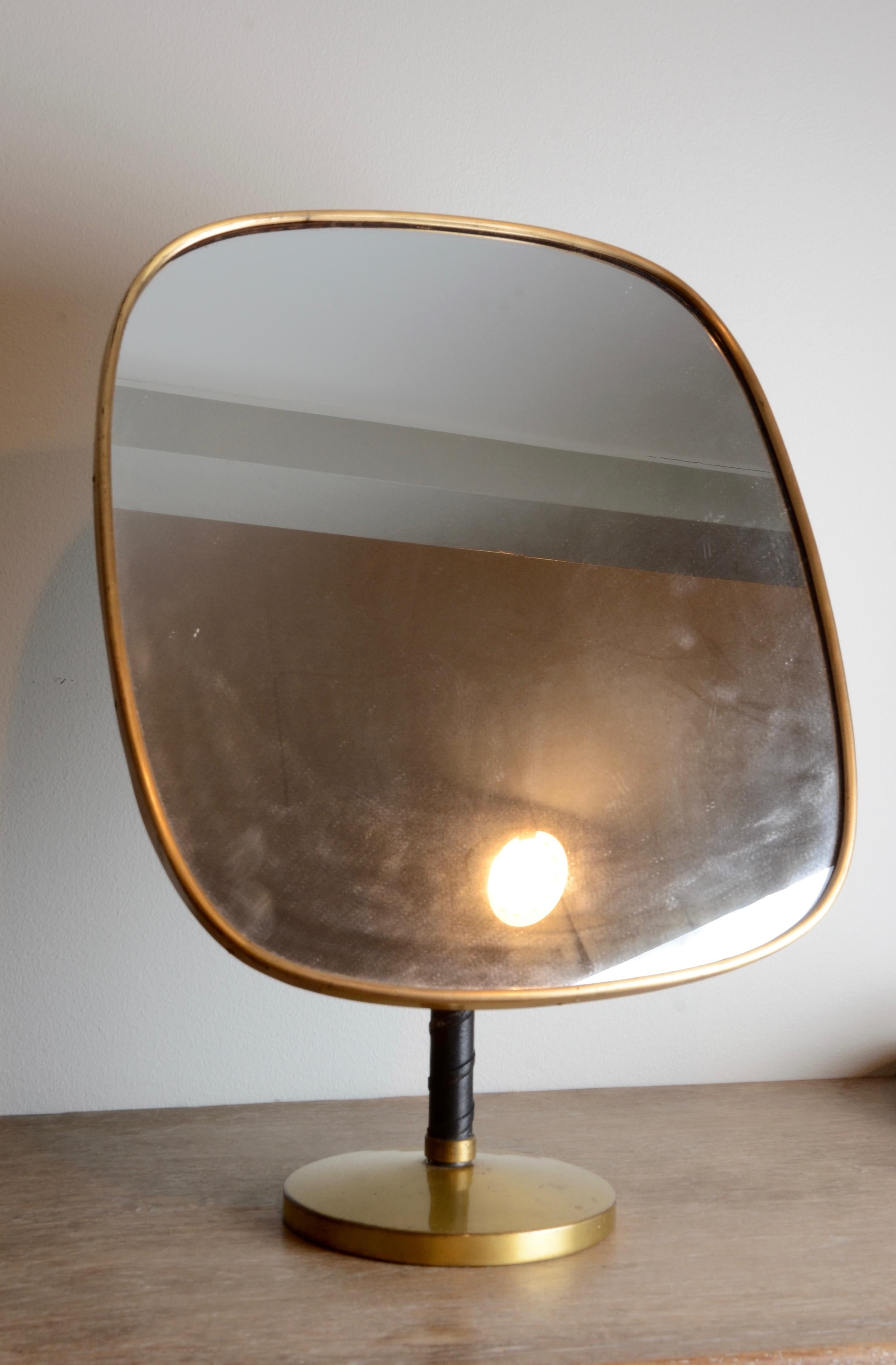 Mirror in brass and leather, designed by Josef Frank for Firma Svenskt Tenn. Sweden, mid1900s.

 