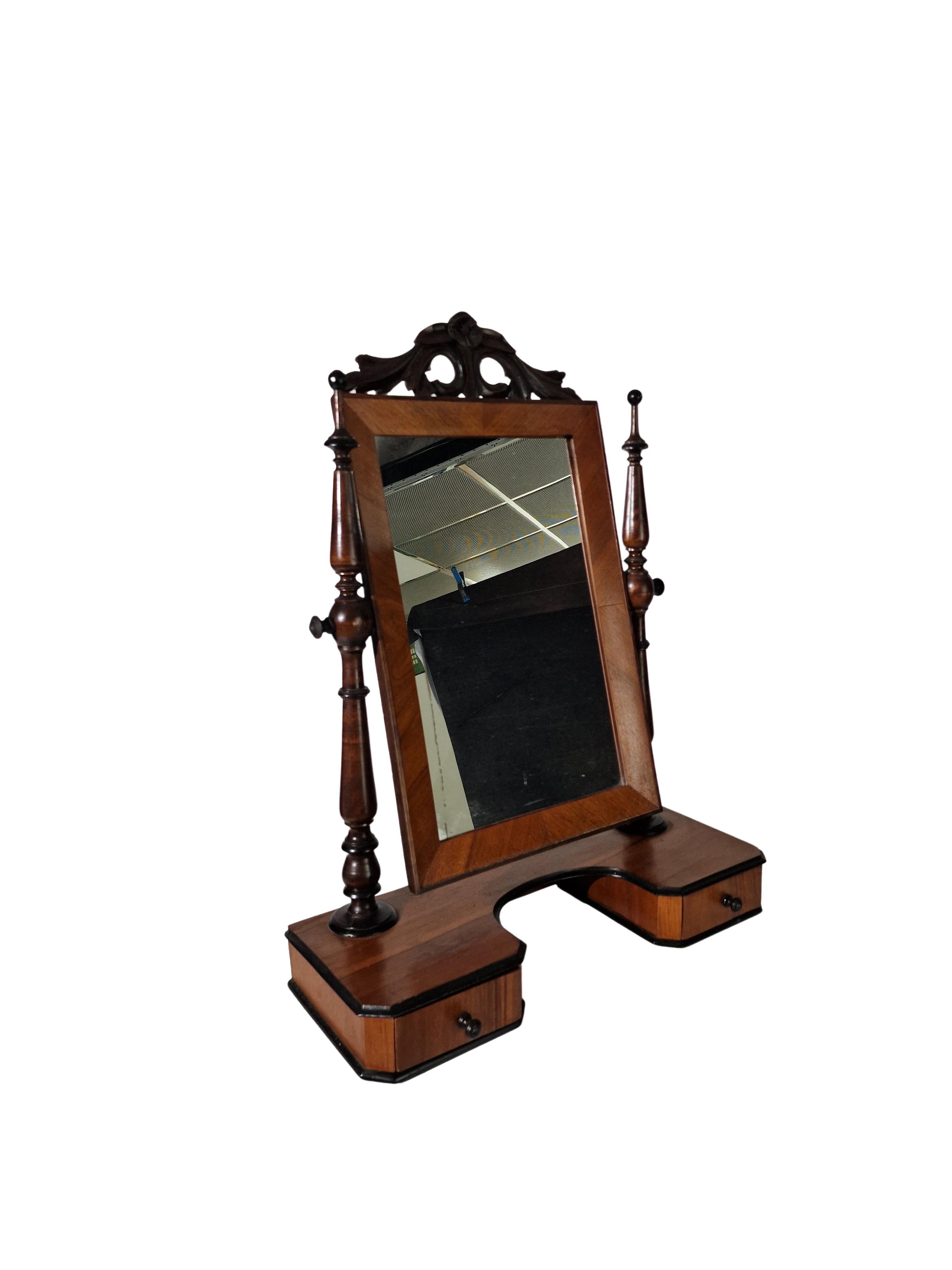 Very decorative table mirror / makeup mirror with swivel mechanism, an original of the Grünerzeit peroid, around 1890, made in Austria. 

The substructure is made of spruce veneered with walnut. The columns and the mirror frame are made of solid