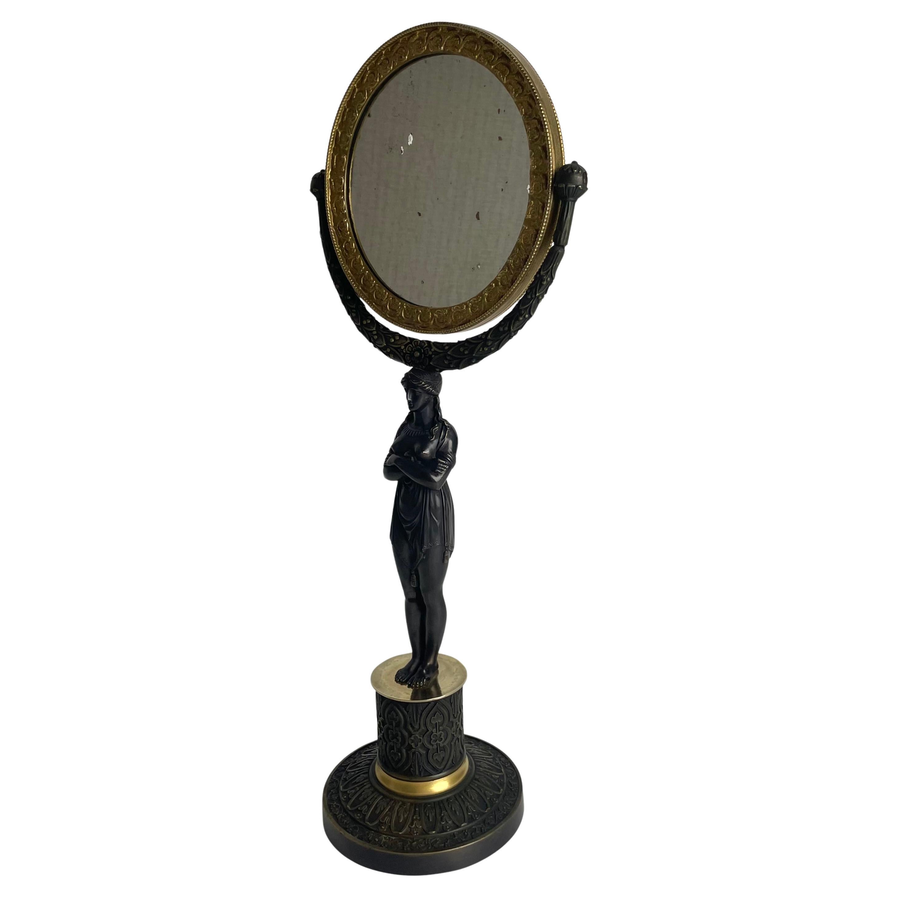 Tischspiegel mit Karyatid im französischen Empire-Stil. Vergoldete und dunkle patinierte Bronze