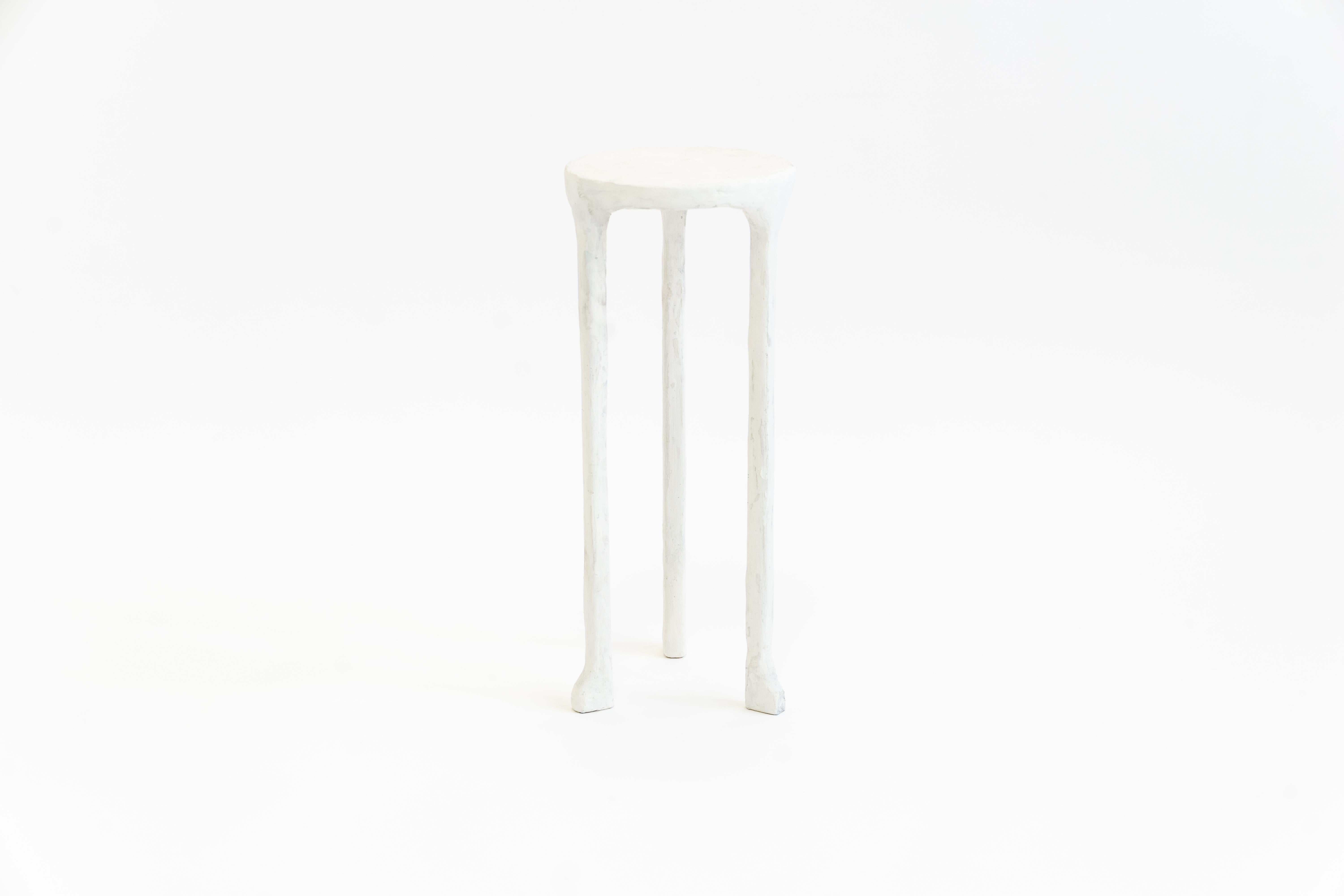 Table No. 3 plaster by JM Szymanski
Dimensions: R 8” x H 20” 
Materials: Carved steel, plaster finish

Our classic side table is hand plastered adding texture and depth to an already beautiful design.

Jake Szymanski lives and designs in New