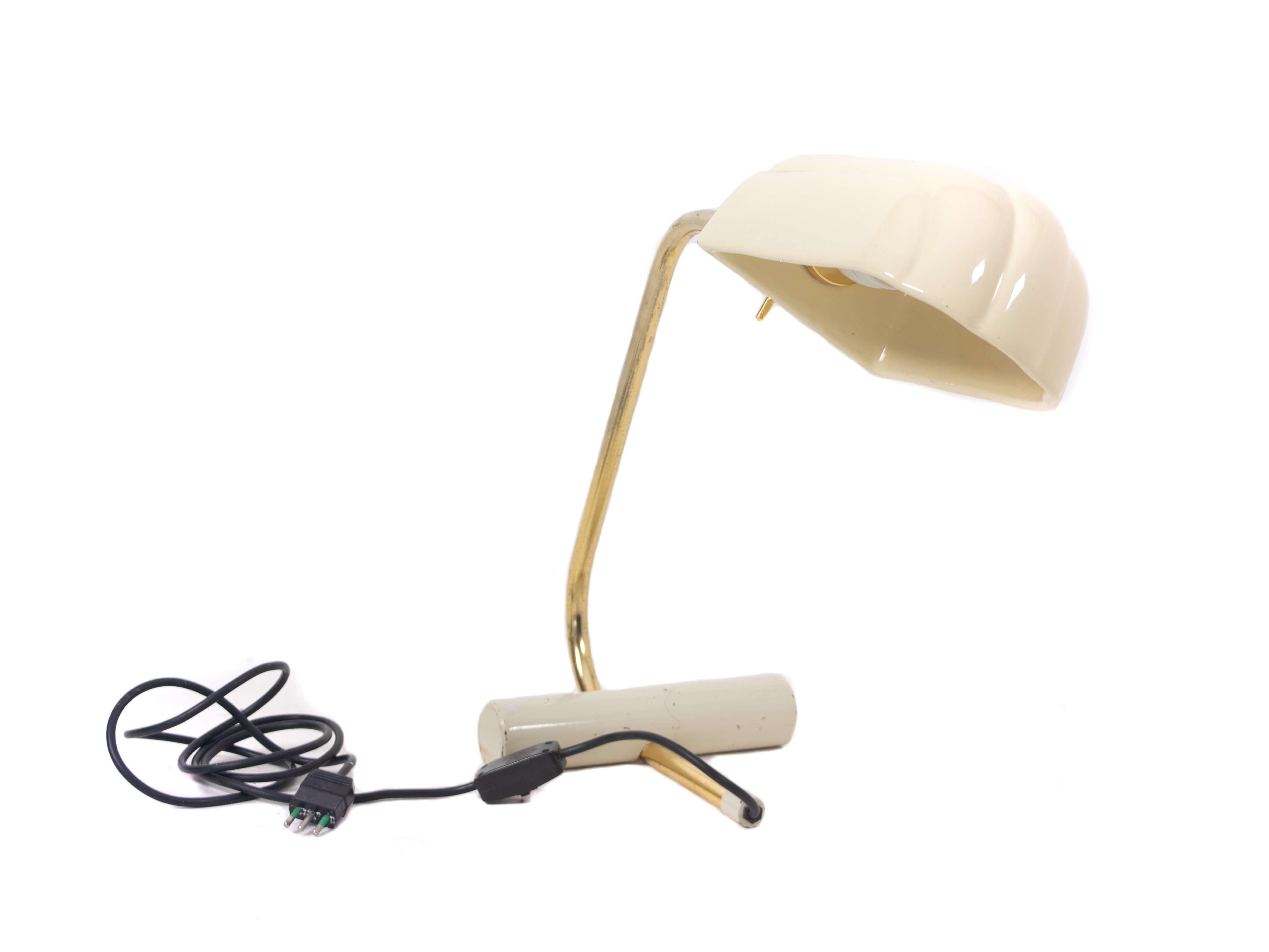 Table or desk lamp with messing structure and white lacquered ceramic lampshade, Italy 1970s/1980s. It has a cylindrical foot in metal and white lacquered steel. The lampshade can be turned for better light. It is in good condition with normal wear