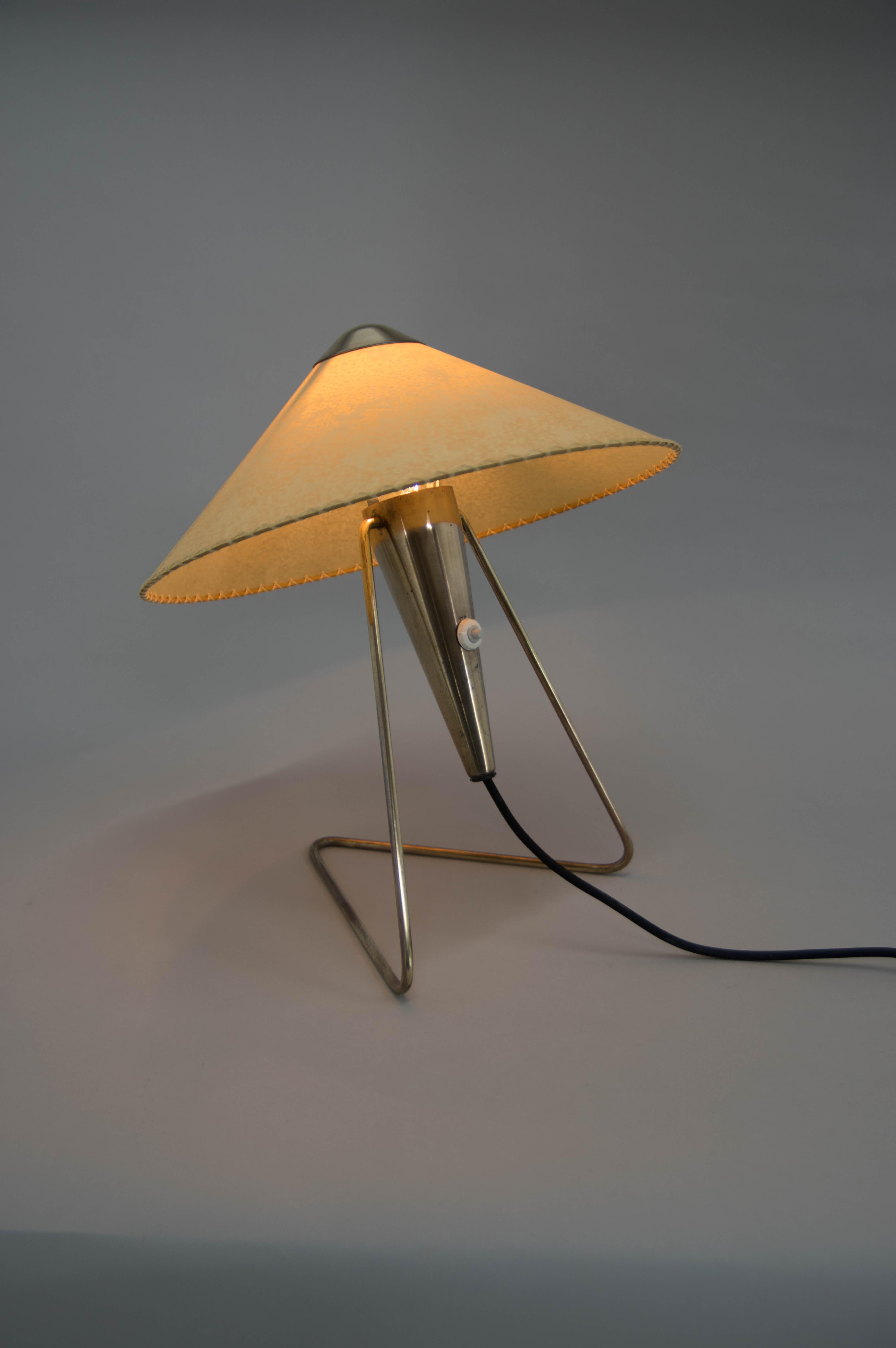 Table or wall lamp designed by Helena Frantova for OKOLO, Czechoslovakia. Perfect condition. Brass polished. New parchment paper shade. Rewired: 1x40W, E25-E27 bulb.
US plug adapter included.