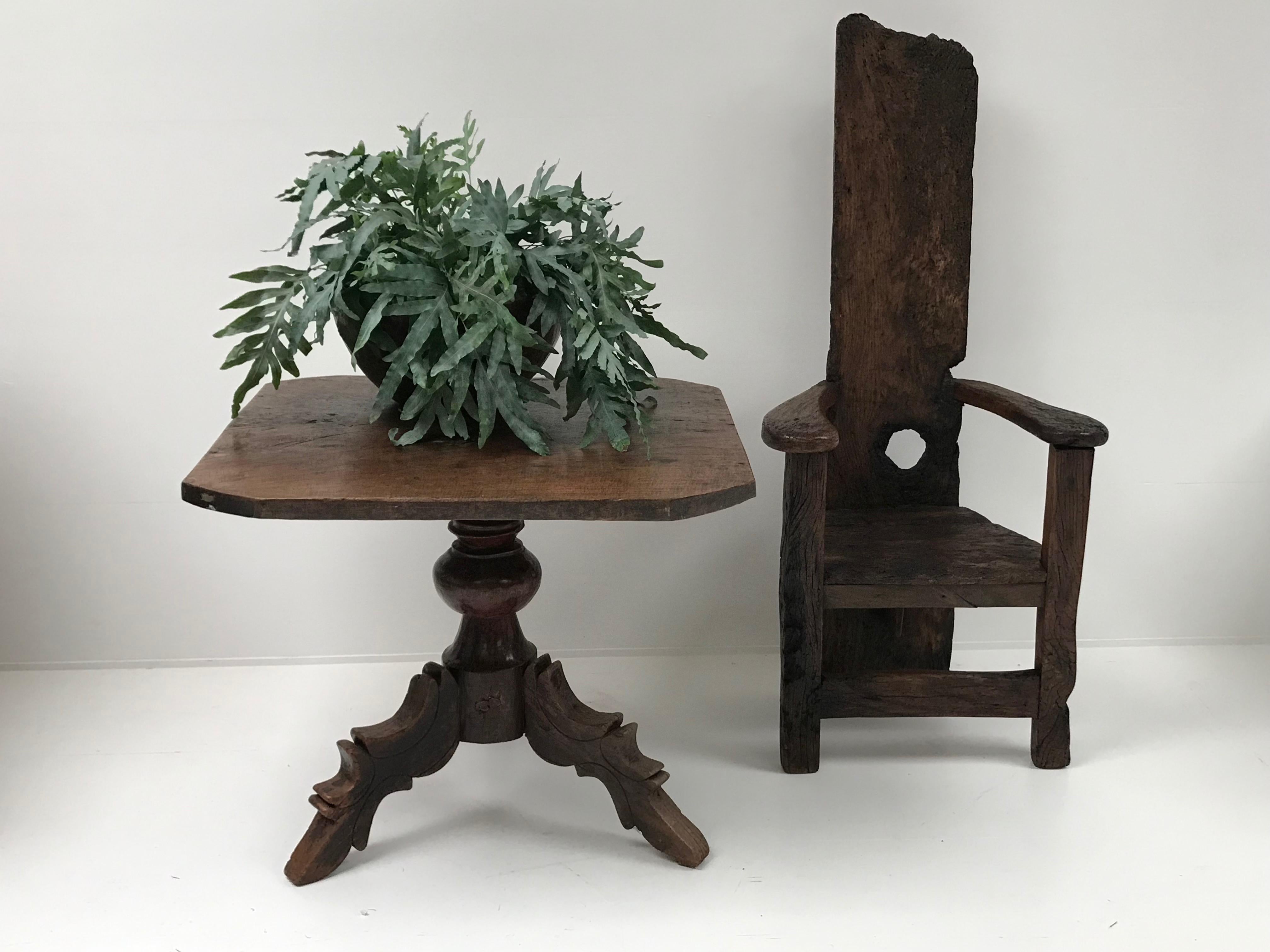 Beautiful teak table on a pedestal
foot 
the top is exceptional because it is one piece solid teak wood
and the square form is very decorative
very thick top of 3 cm.