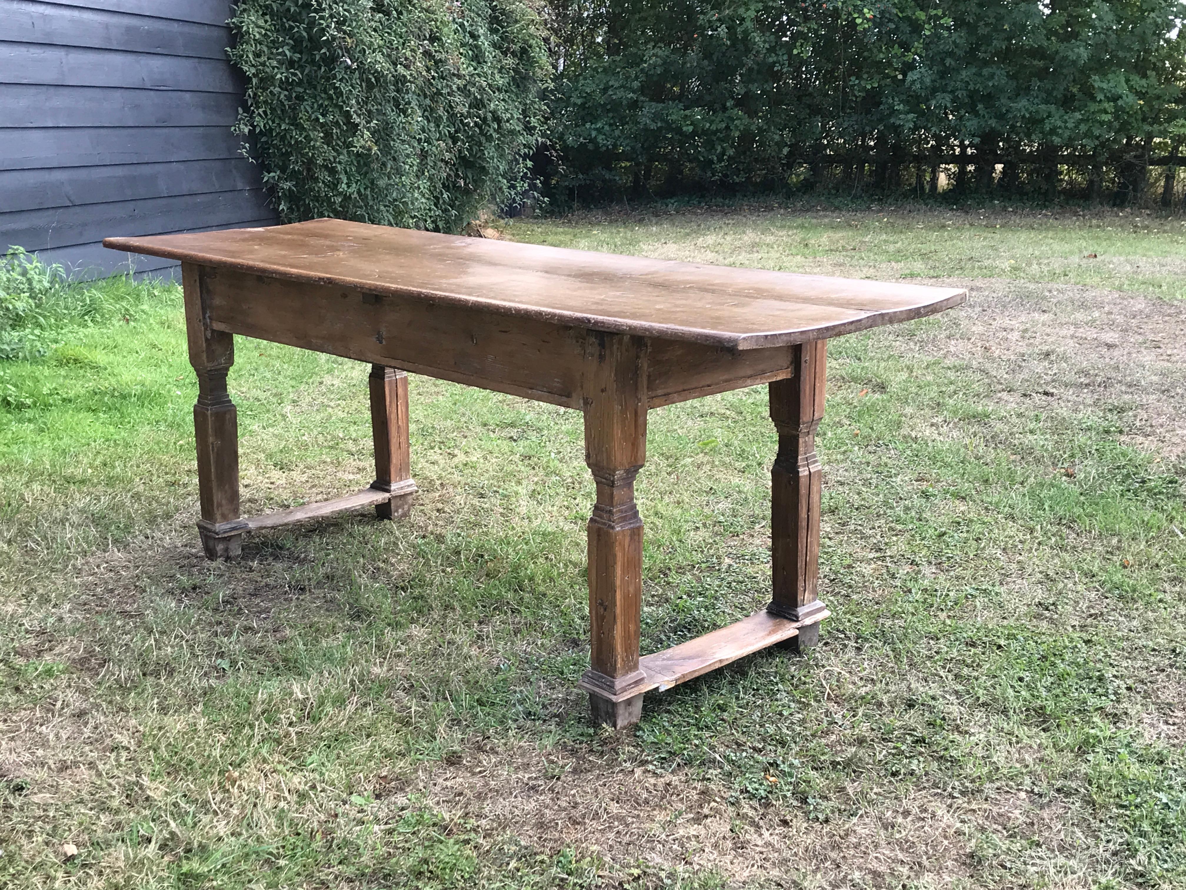 Pine farmhouse table with a single plank top
Rare to find a piece of vernacular or folk furniture with sophisticated features like the leg turnings on this table 

Length 206cm 81