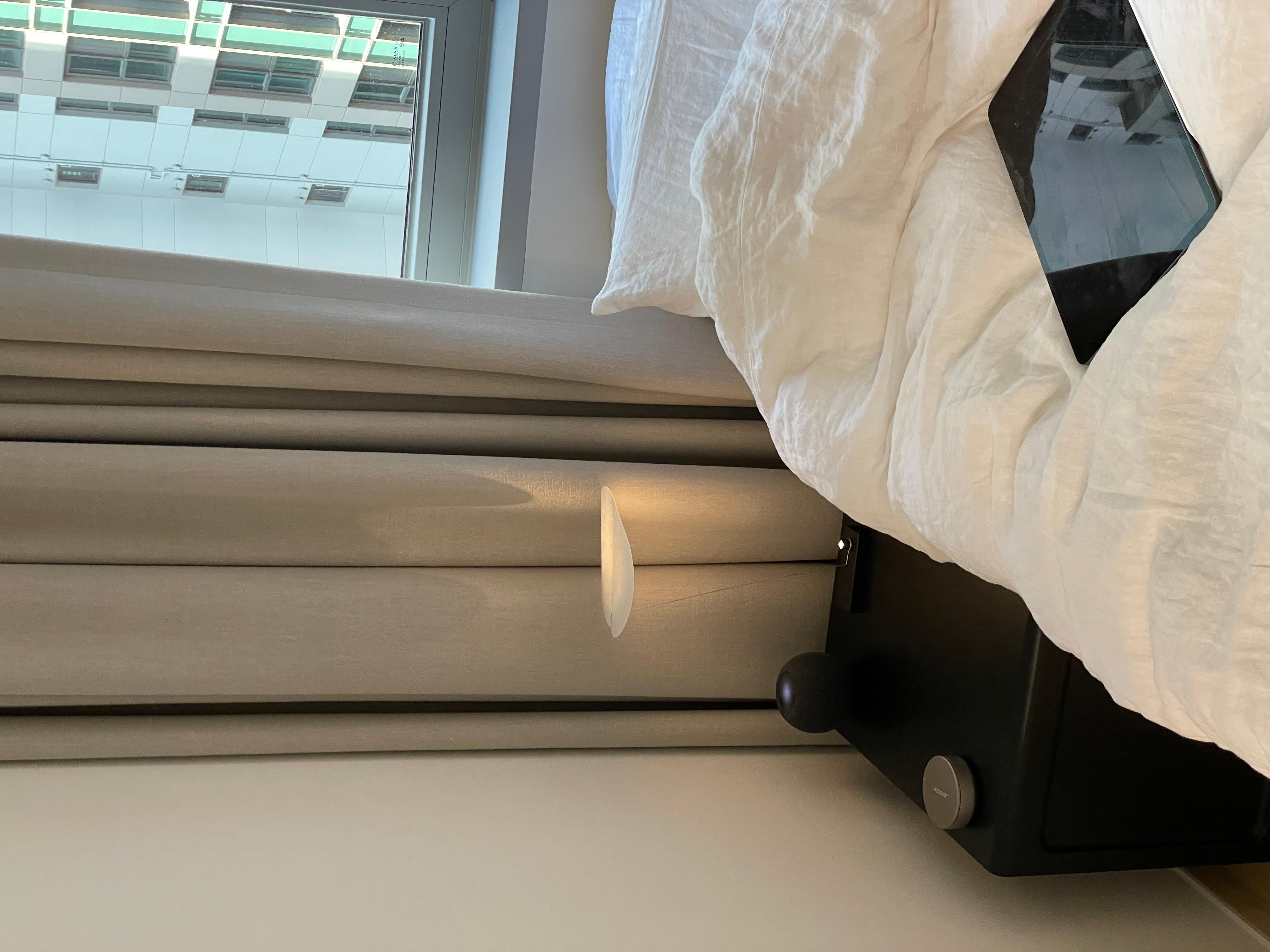 Model: Koyoo Table/Portable Lamp
Designer: Axel Schmid

Koyoo by Axel Schmid for Ingo Maurer is a portable light object with a poetic and minimalist design. A luminous circle floats above a narrow black base, supported by a wire spring. The