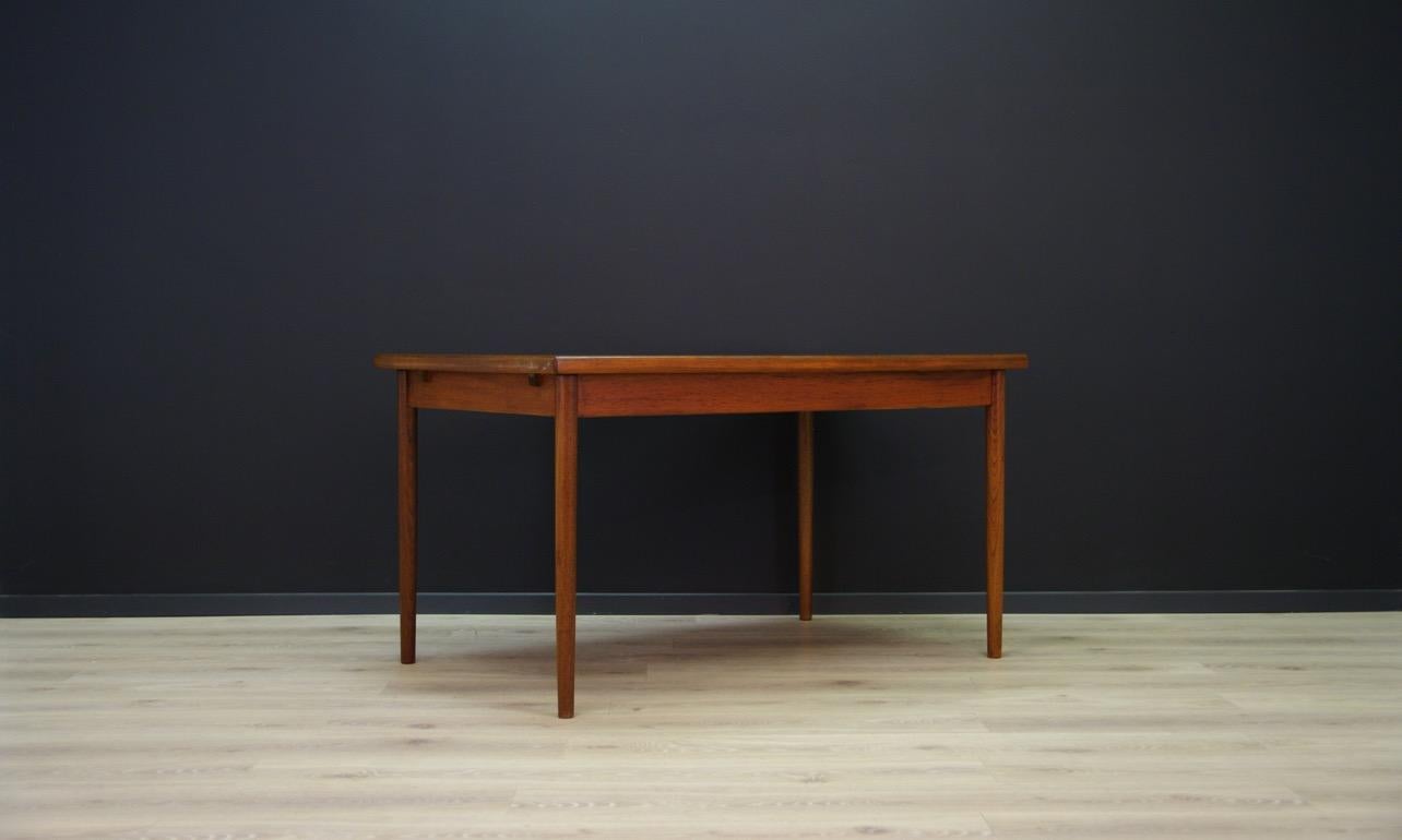 Classic table from the 1960s-1970s, Scandinavian design, Minimalist form finished with teak veneer, legs made of teak wood. The table has 2 pull-out inserts. Preserved in good condition (small scratches and dings) - directly for use.

Dimensions: