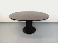 Table ronde de repas vintage en mélaminé esprit bois noir et métal chromé