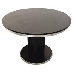 Table ronde de repas vintage en mélaminé esprit bois noir et métal chromé