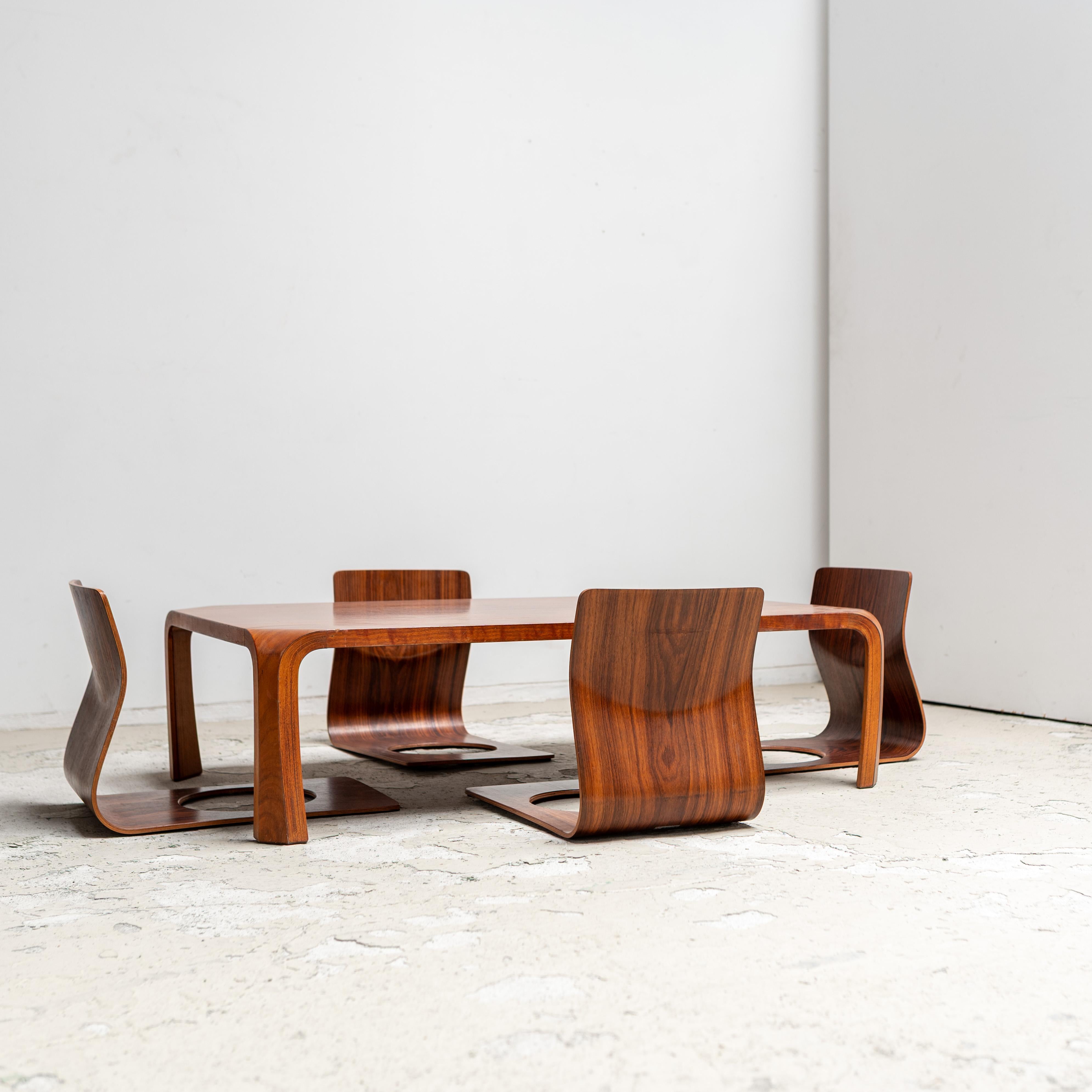 Timeless design by Tendo Mokko. The set includes a low table and a set of zaisu chairs.  The beauty of the lines, lightness, and functionality reflect Japanese aesthetics and craftsmanship, setting the tone for versatility and modernity.

This