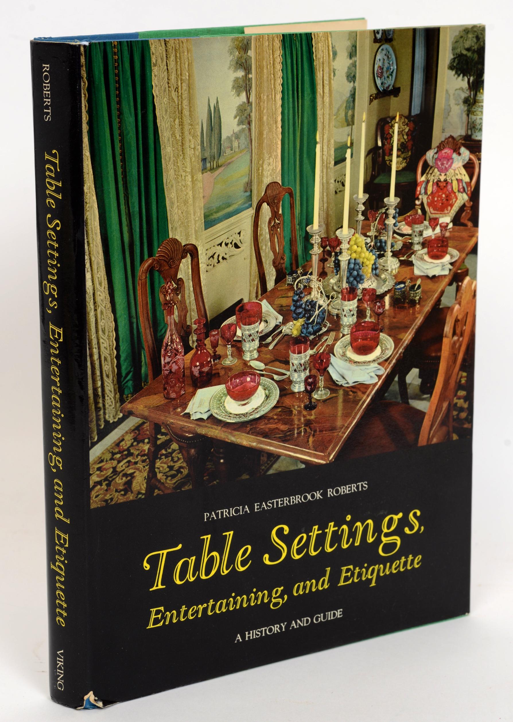 Table Settings, Entertaining and Etiquette: A History and Guide by Patricia E. Roberts. Viking Press, New York, NY, 1967. Third Edition hardcover with dust jacket. A concise history of good manners and utensils are displayed. It presents many