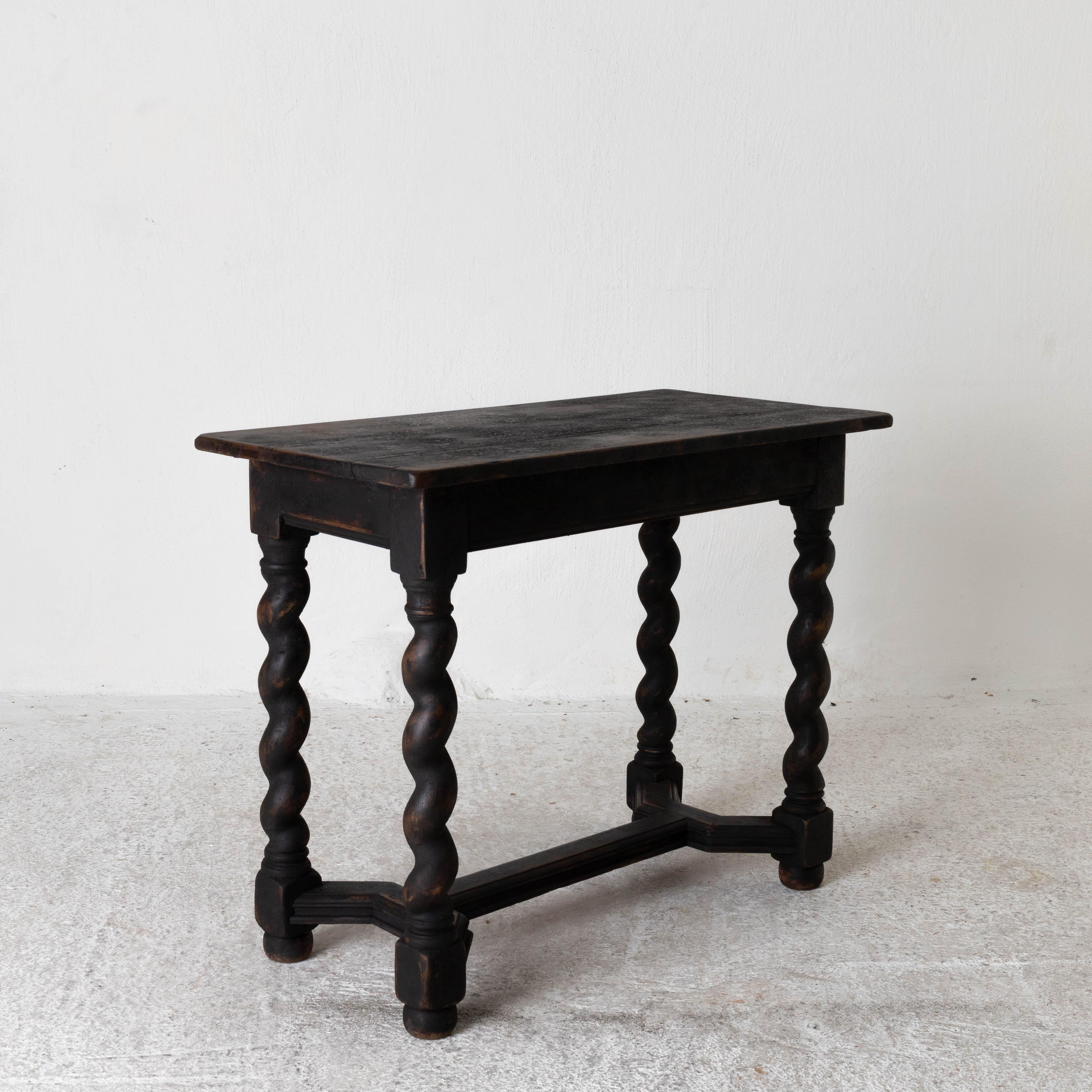 Table side Swedish Baroque black 18th century spiral legs, Sweden. A table made during the Baroque, period 1650-1750. Rectangular top on a base with spiral legs tied together with a foot cross. Refinished in our Laserow black. Perfect size for a