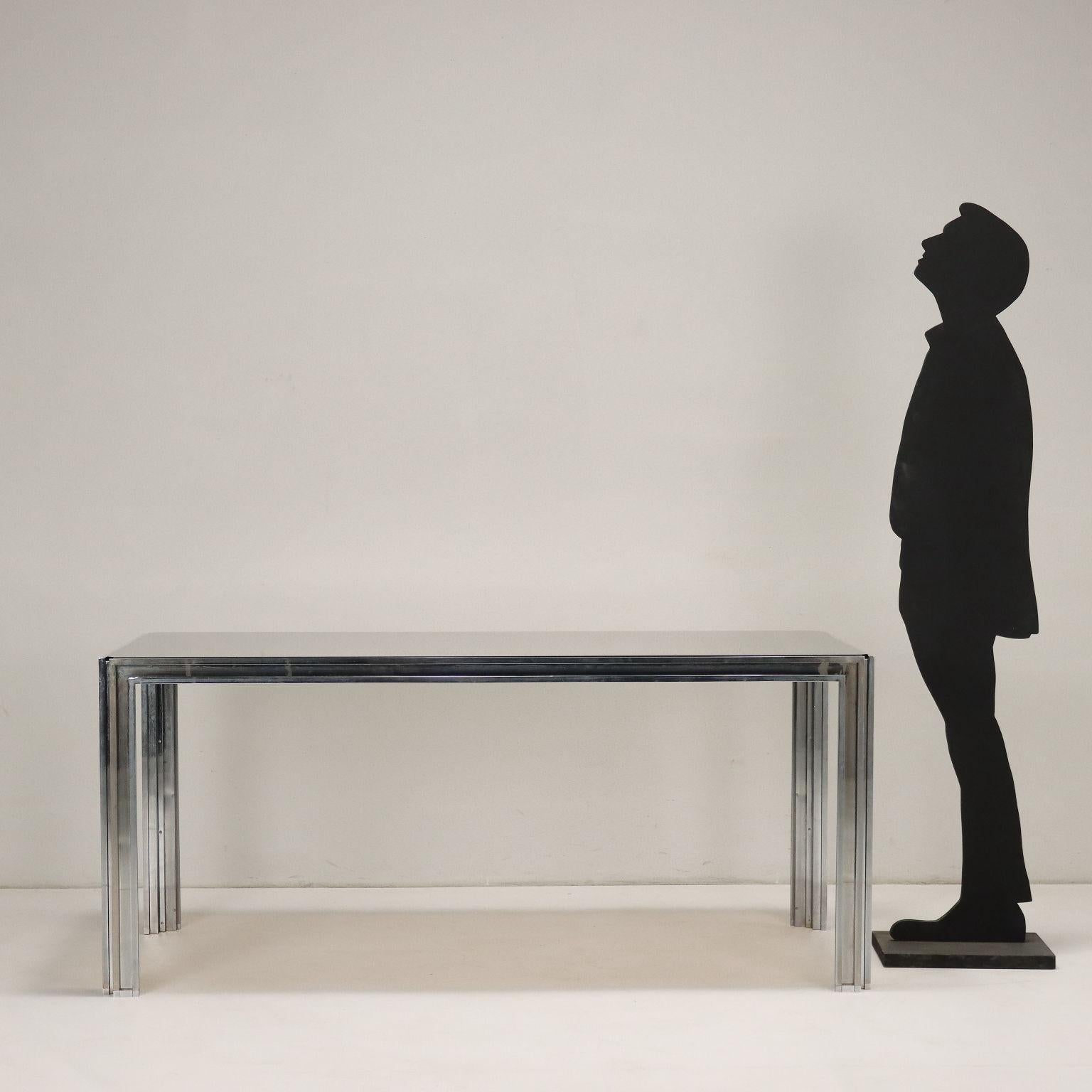 Table; chromed brass structure, smoked glass top.