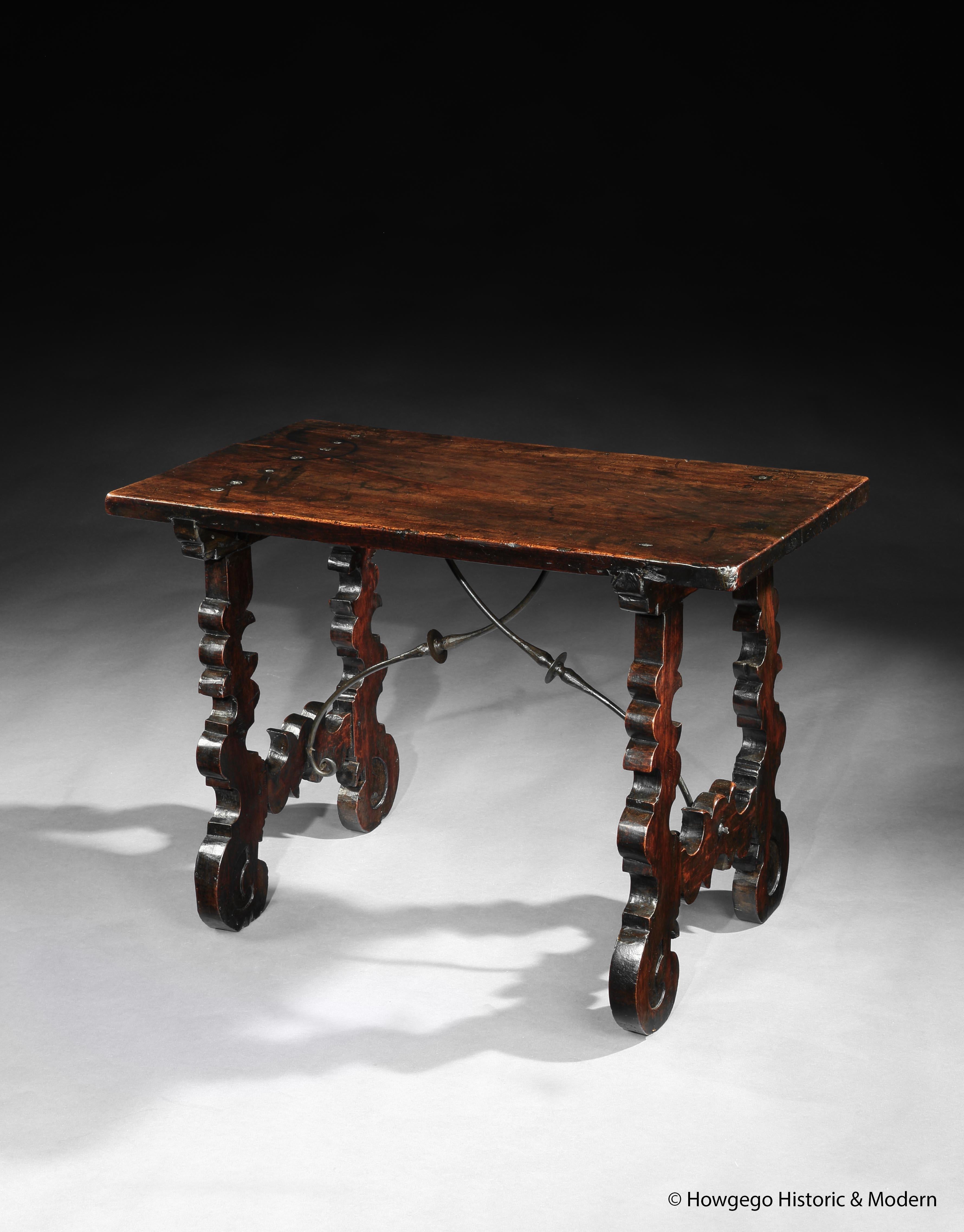 - Unusual, small, narrow size
- Characterful one piece walnut top with stunning lustrous, rich patina and original iron studs at either end of the top forming part of the aesthetic
- There is fracture along the top, it is not a break as it does