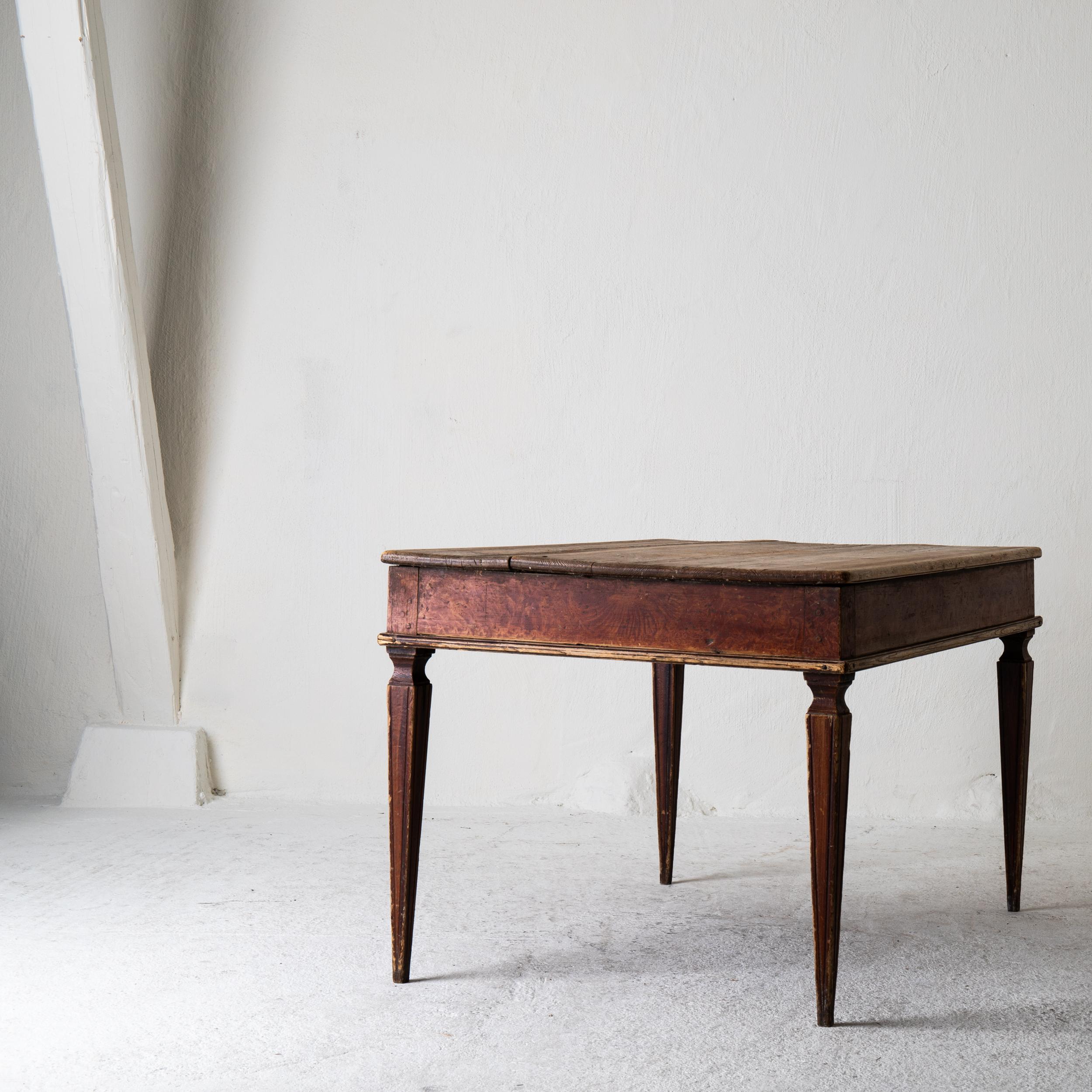Table Swedish Gustavian 18th century original paint Sweden. A side table made during the 18th century in Sweden. Original reddish finish and paint. Tapered and channeled legs.

  