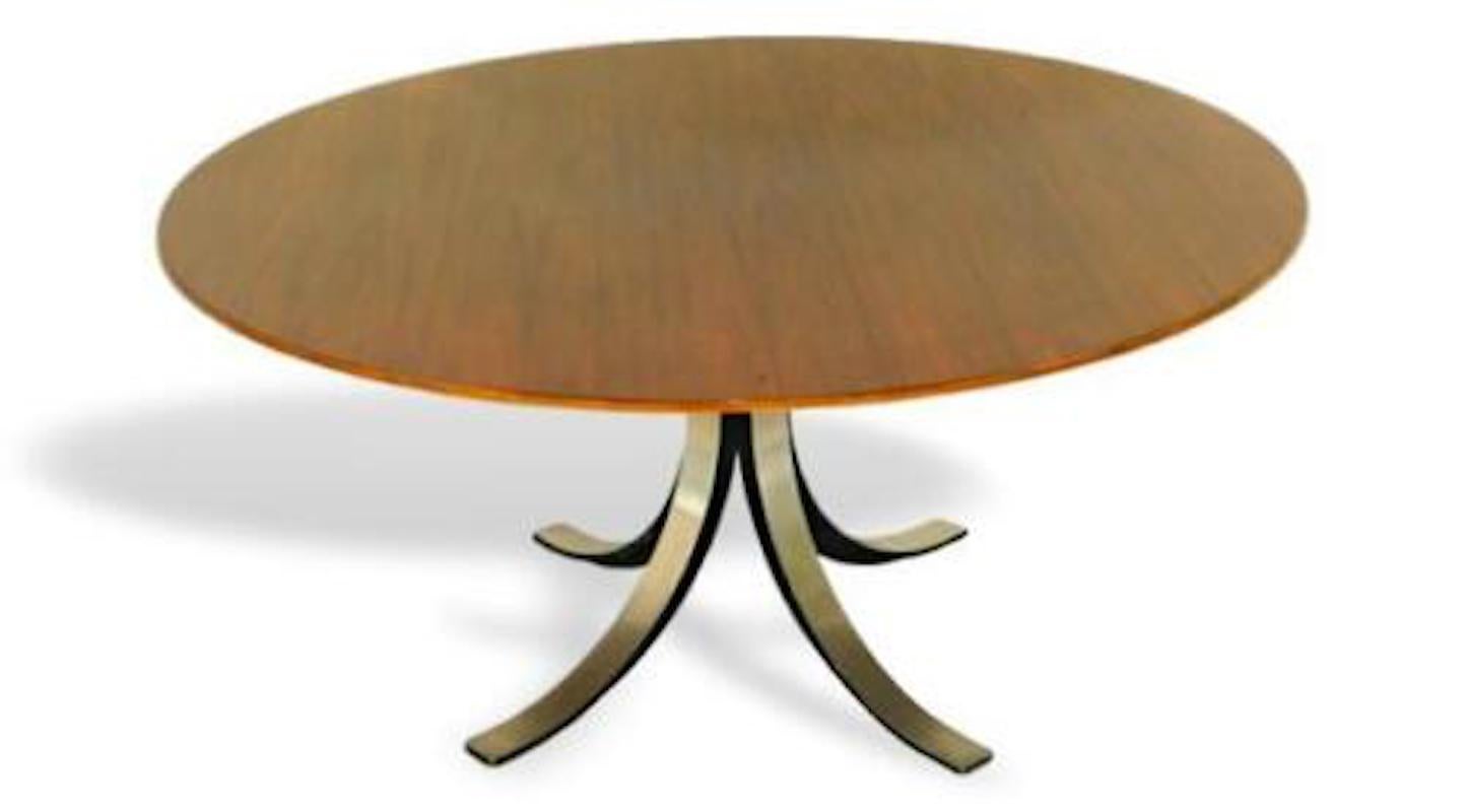 Superb and very rare T69 table designed by osvaldo borsani and eugenio gerli for tecno

Iroko top, with the four famous saber feet by tecno

Top diameter cm. 130, in excellent storage conditions

Very rare !!!