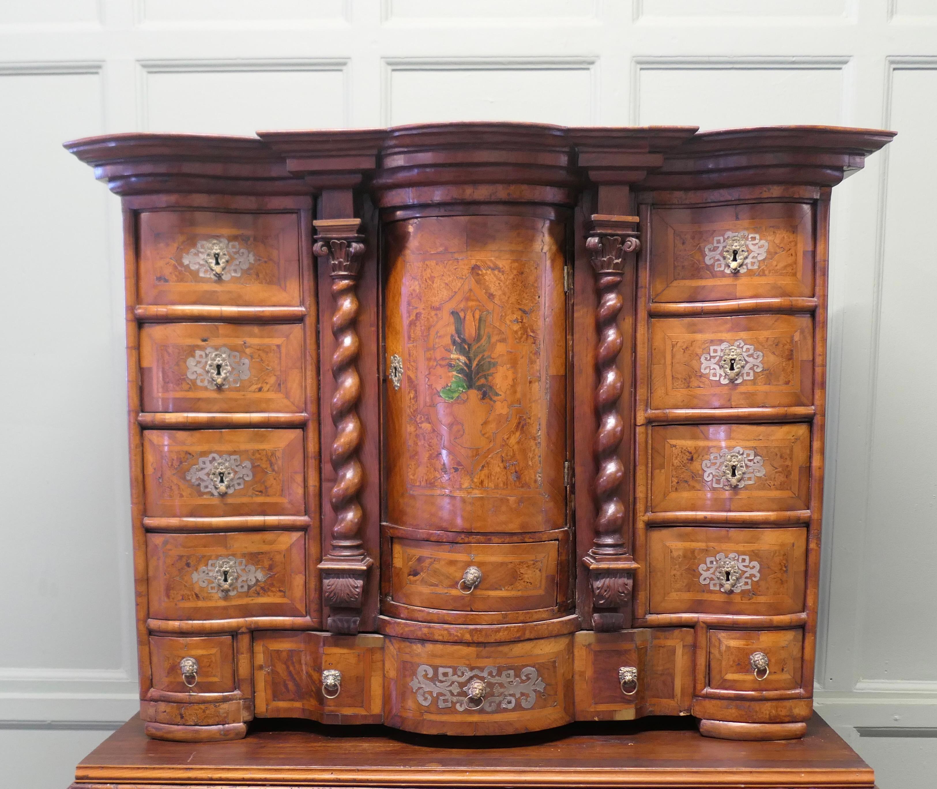 Table Top Escritoire with Revolving Tabernacle 

This piece is made in superb Walnut veneers, it is of European in origin with many drawers and a disguised central section, it has a cylindrical door at the centre which conceals a revolving secret