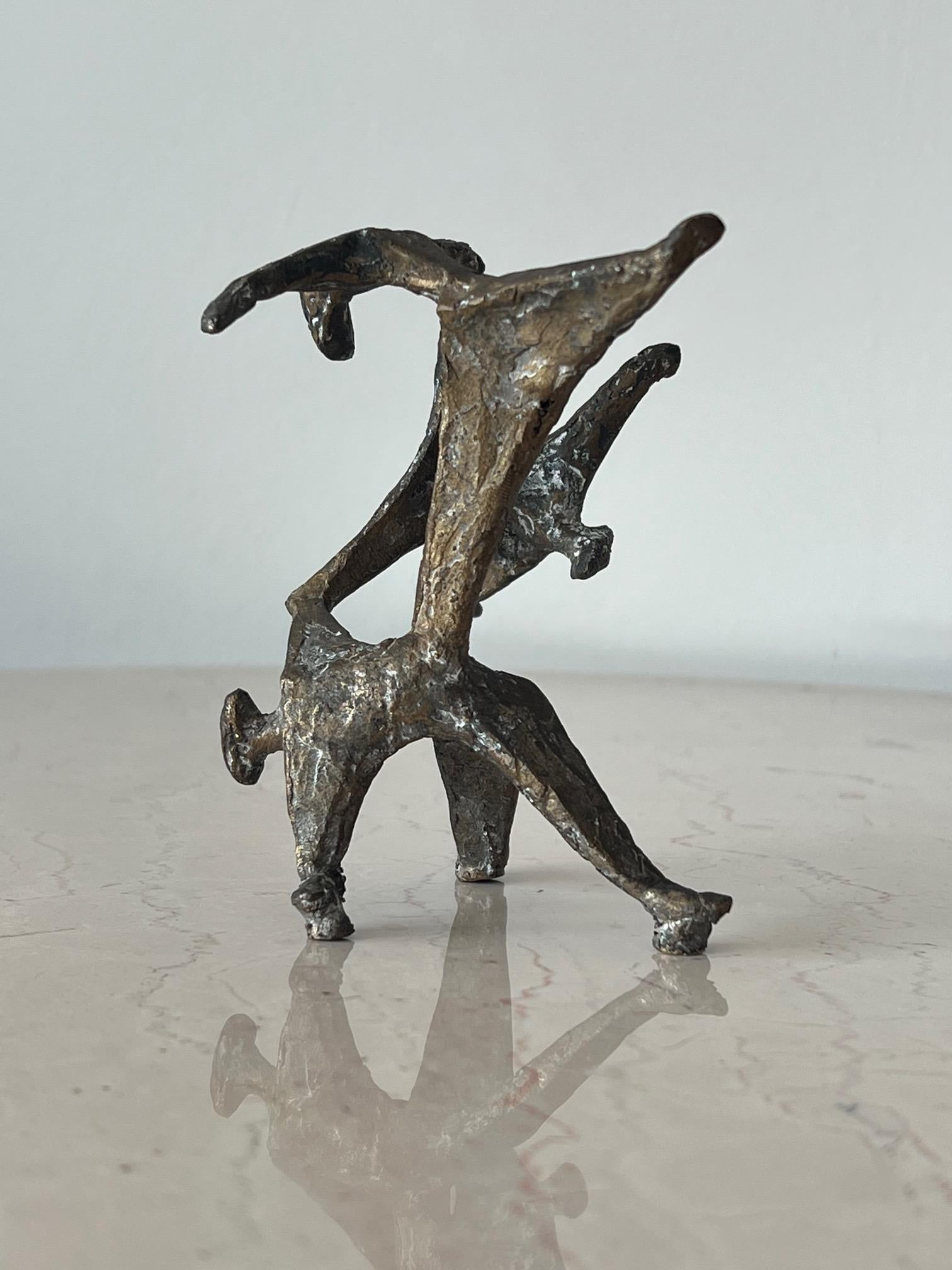 A unique Anne Van Kleeck bronze, table top sculpture of abstracted figures, dancers perhaps. From the artist's estate. A note about the artist: Anne Van Kleeck was primarily known for her works in cast bronze and ceramics. She attended Ohio Wesleyan