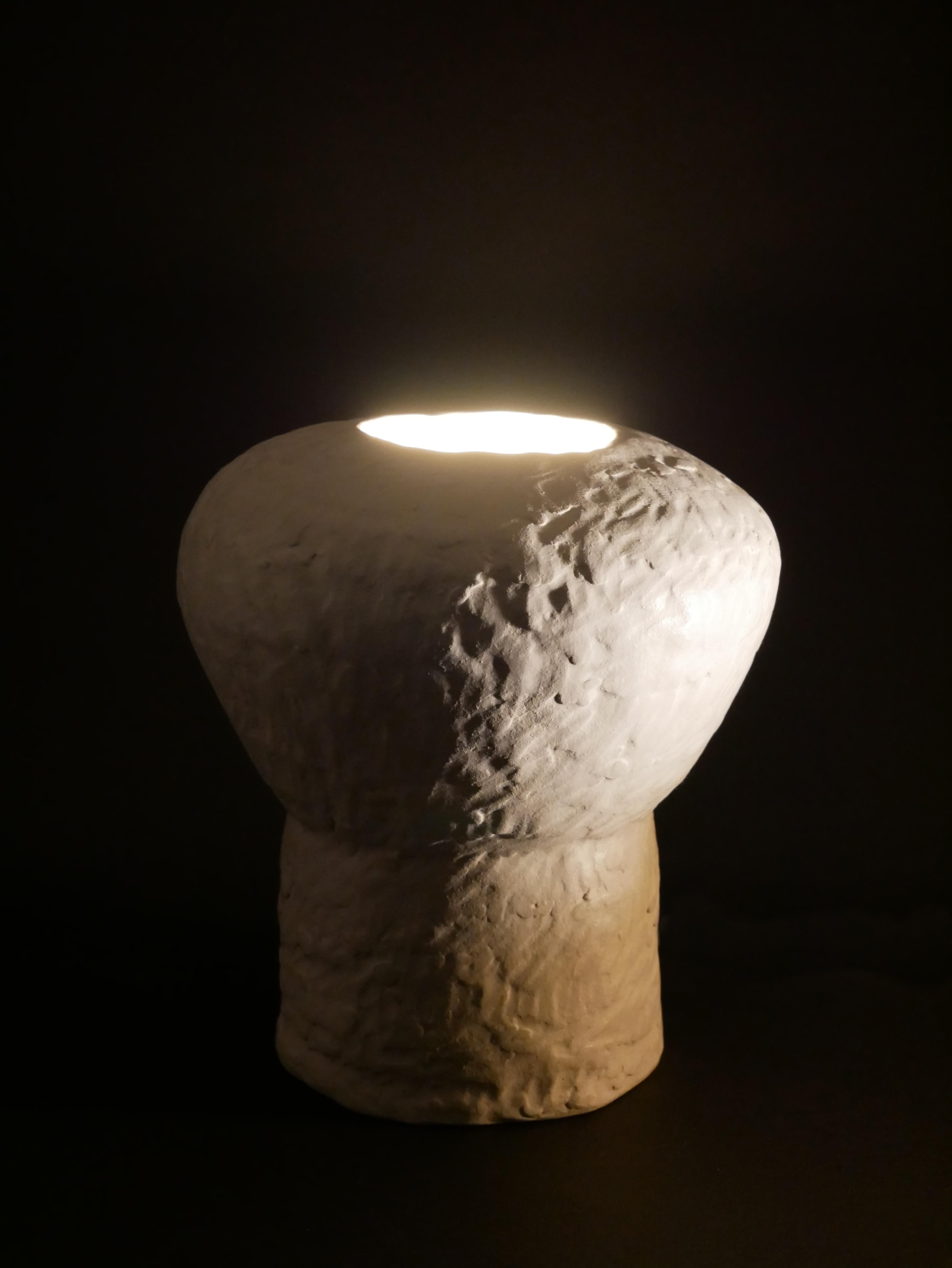 White chamotte stoneware table lamp created by Claire Cosnefroy in 2023. Unique piece, signed, and dated. US and UK electrical wiring available upon request.

Claire Cosnefroy was born in Cotentin in Normandy, from where she keeps a taste for