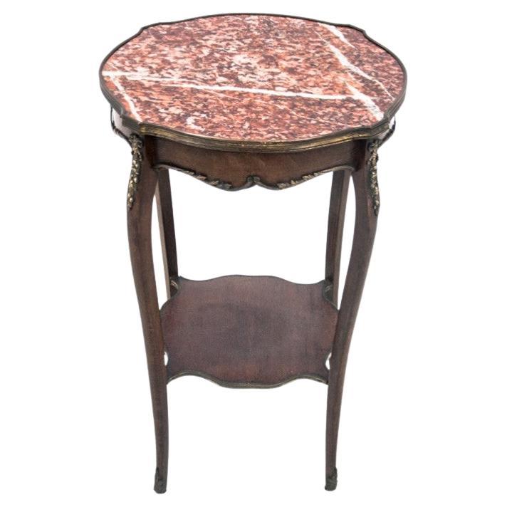 Table with a marble top, France, around 1910. For Sale