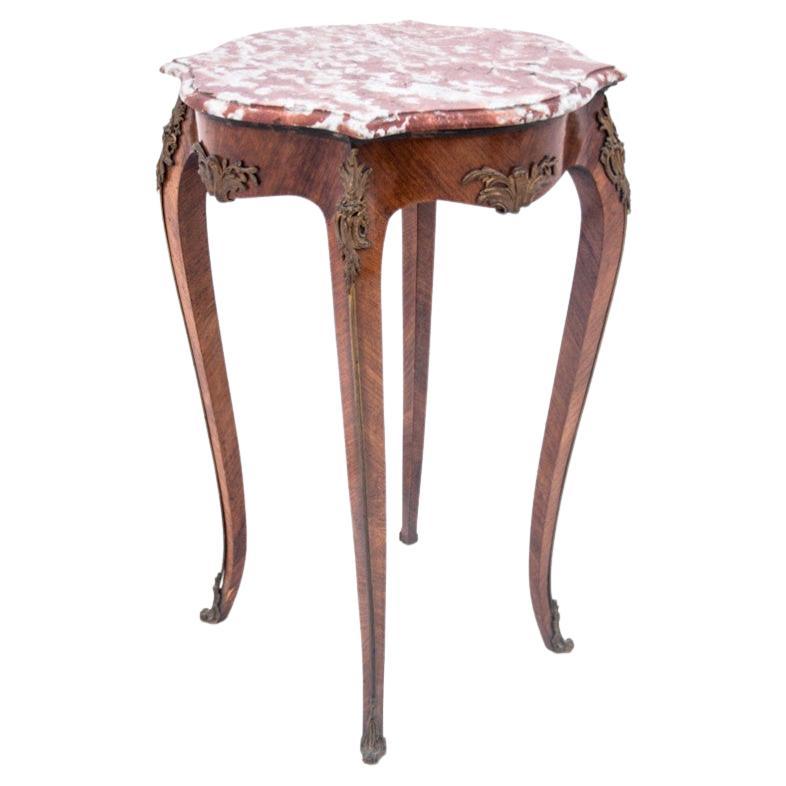 Table with a marble top, France, around 1910. For Sale