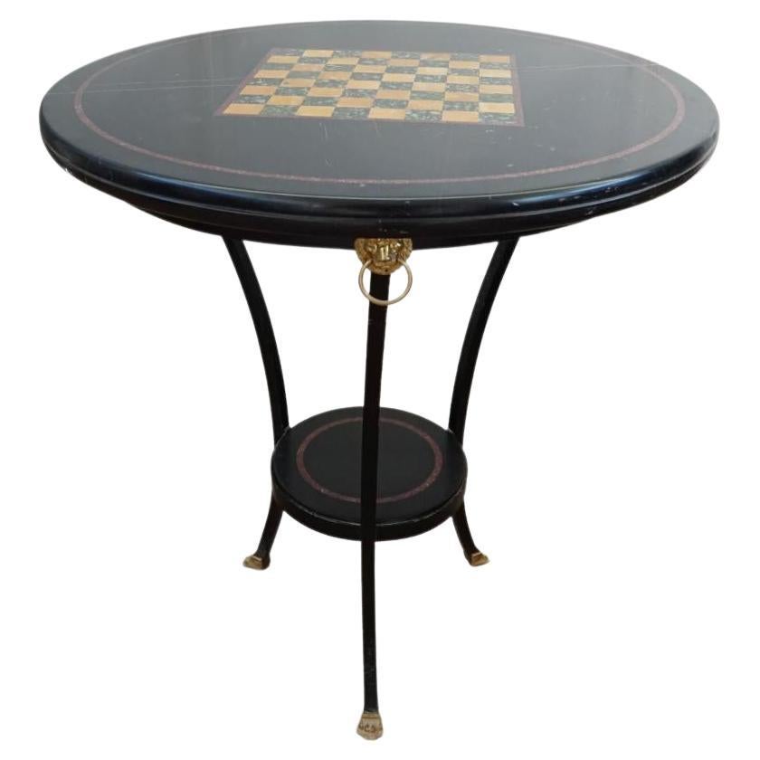 Table avec plateau en marbre noir incrusté