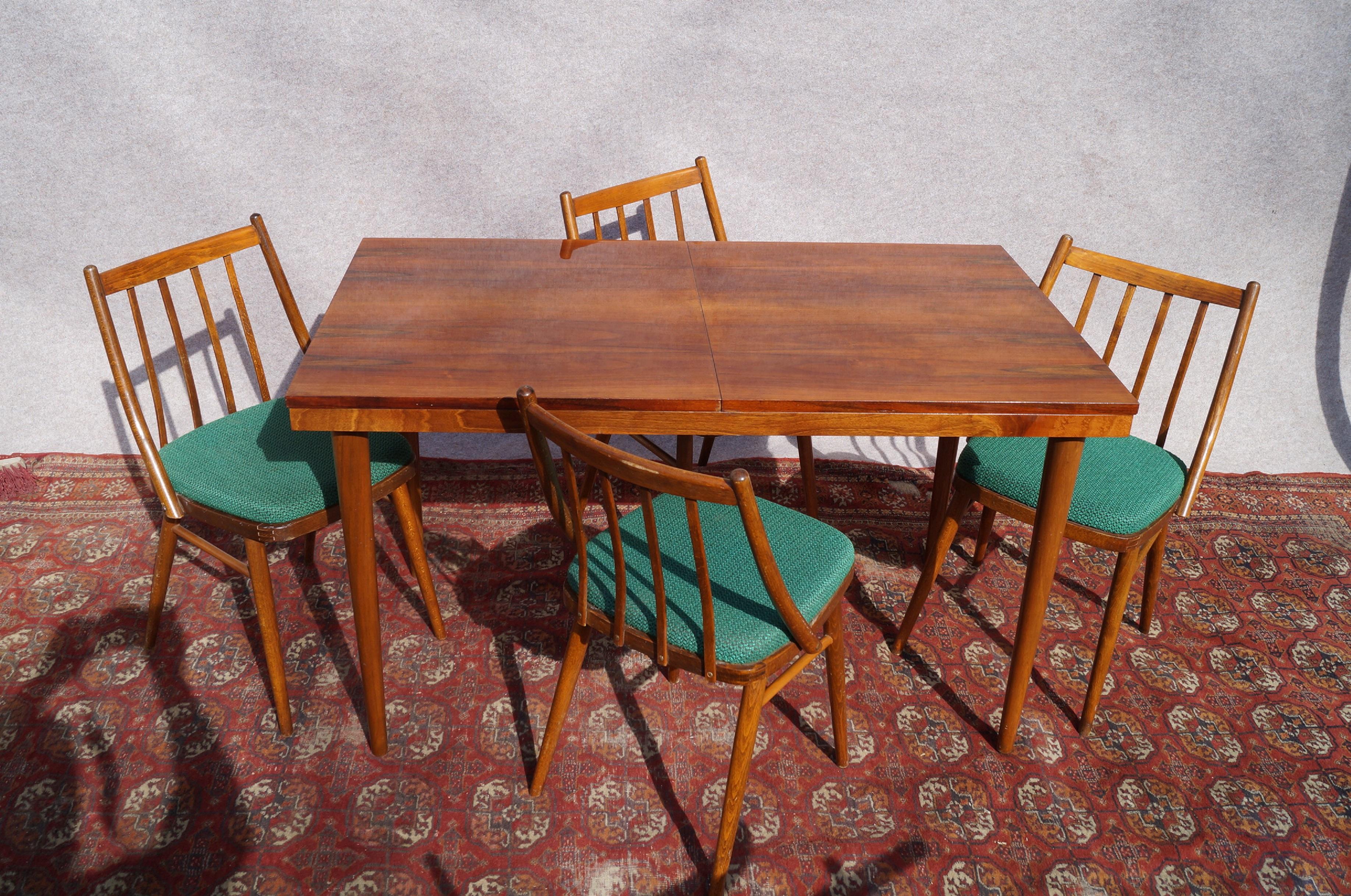 We present dining set including a table and four chairs made in 1960 by a Czech designer Szuman 
 
Highly recommended item will be perfect complementation of the rooms in not only classic style, but also Art Deco and modern.

Measures: Table: