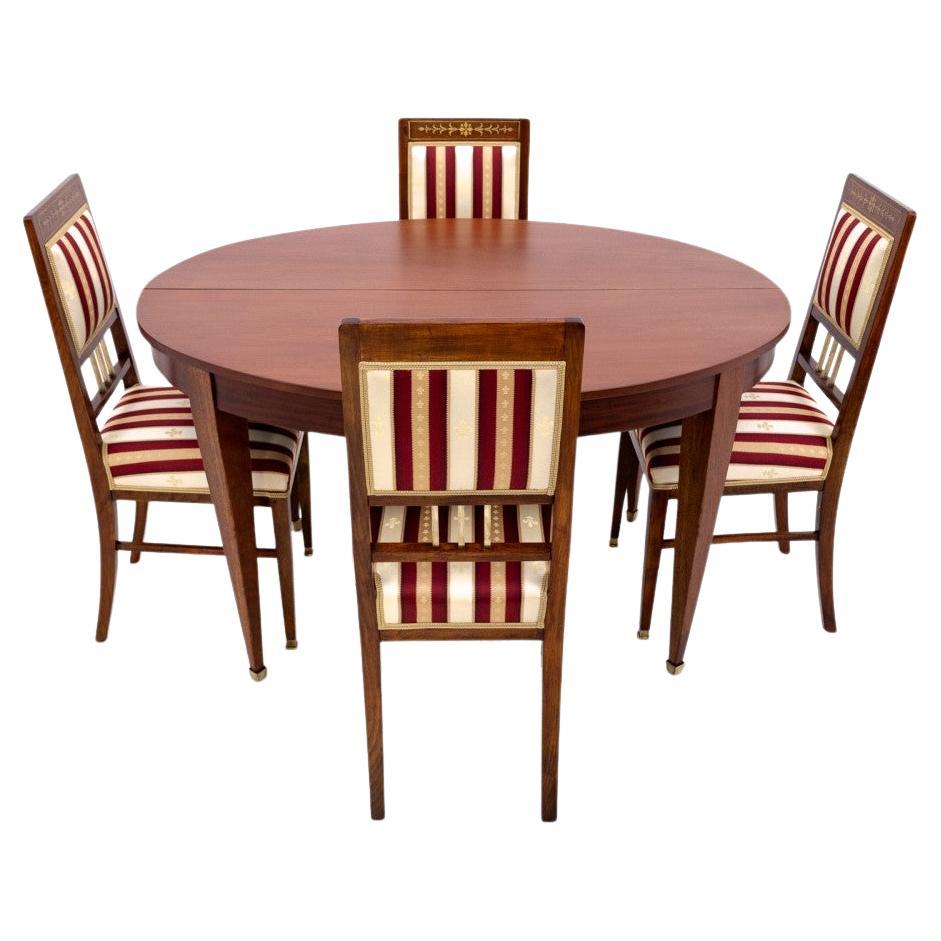 Table with chairs in Empire style, France.