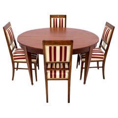 Table with chairs in Empire style, France.