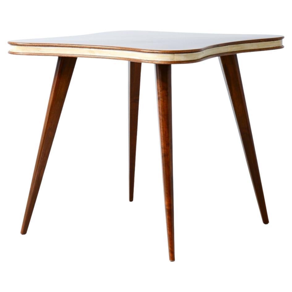 Table with cloverleaf top in veneered walnut and parchment profile For Sale