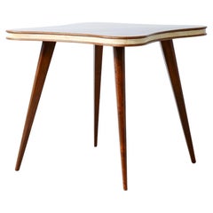 Table with cloverleaf top in veneered walnut and parchment profile