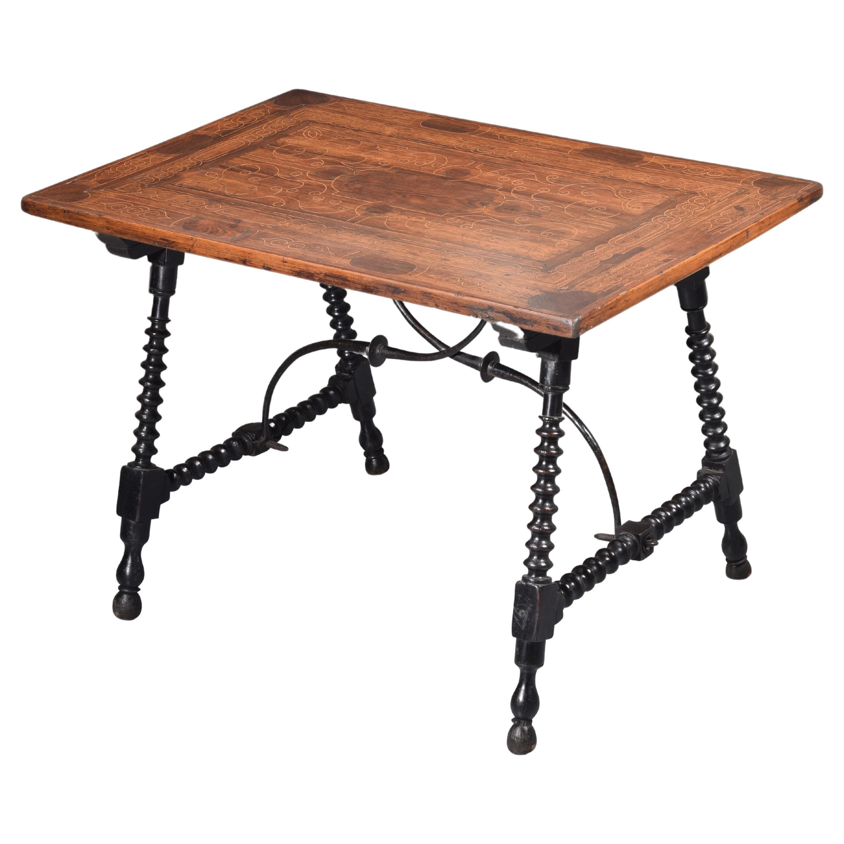 Table with marquetry top. Wood, iron.  18th century. For Sale