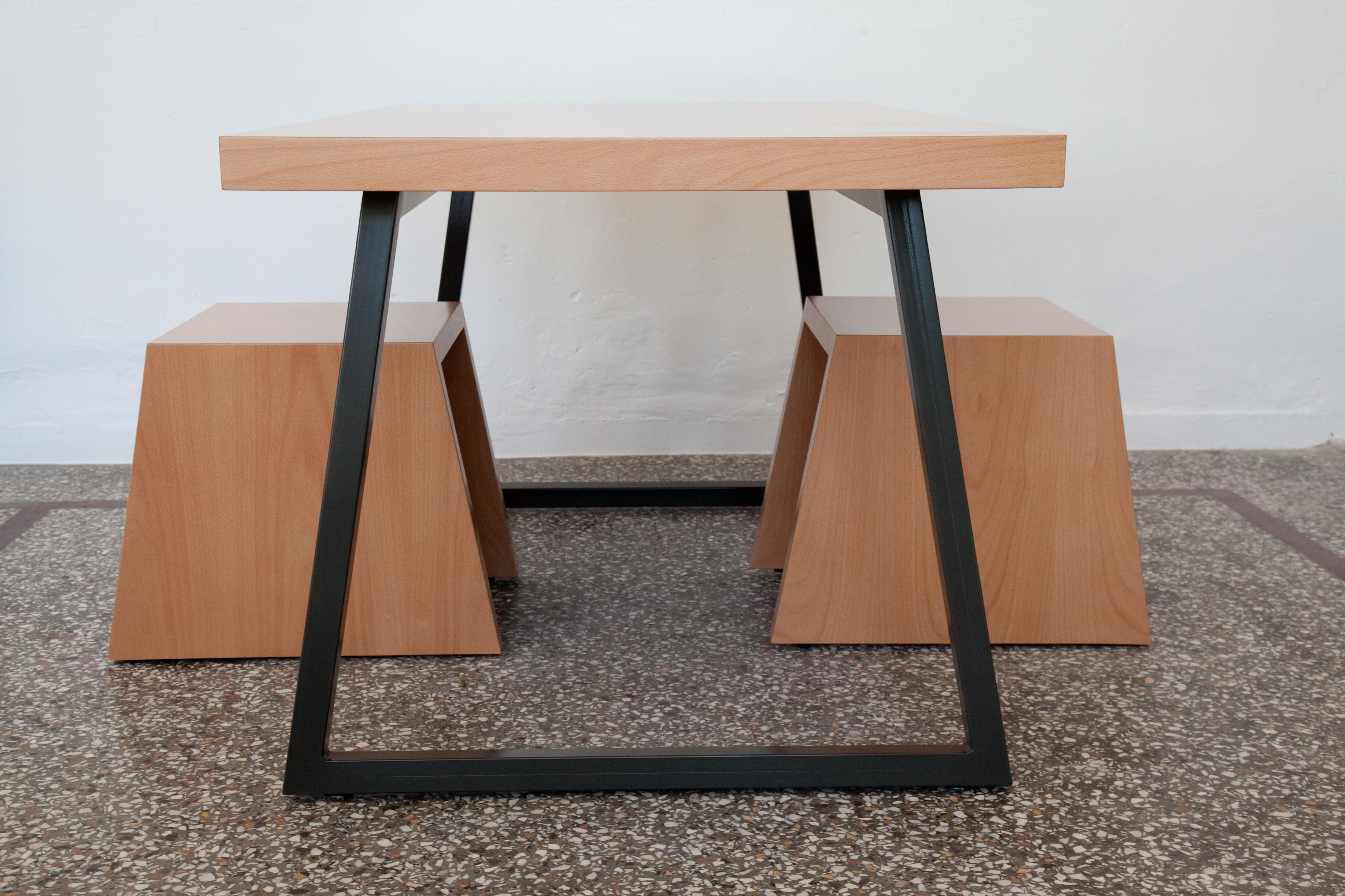 Table with metal base made of MDF lined beechwood. The base is bent, galvanised metal, oven-painted with acrylic grey color.
Measures: 86 cm x 140 cm x 76 cm.