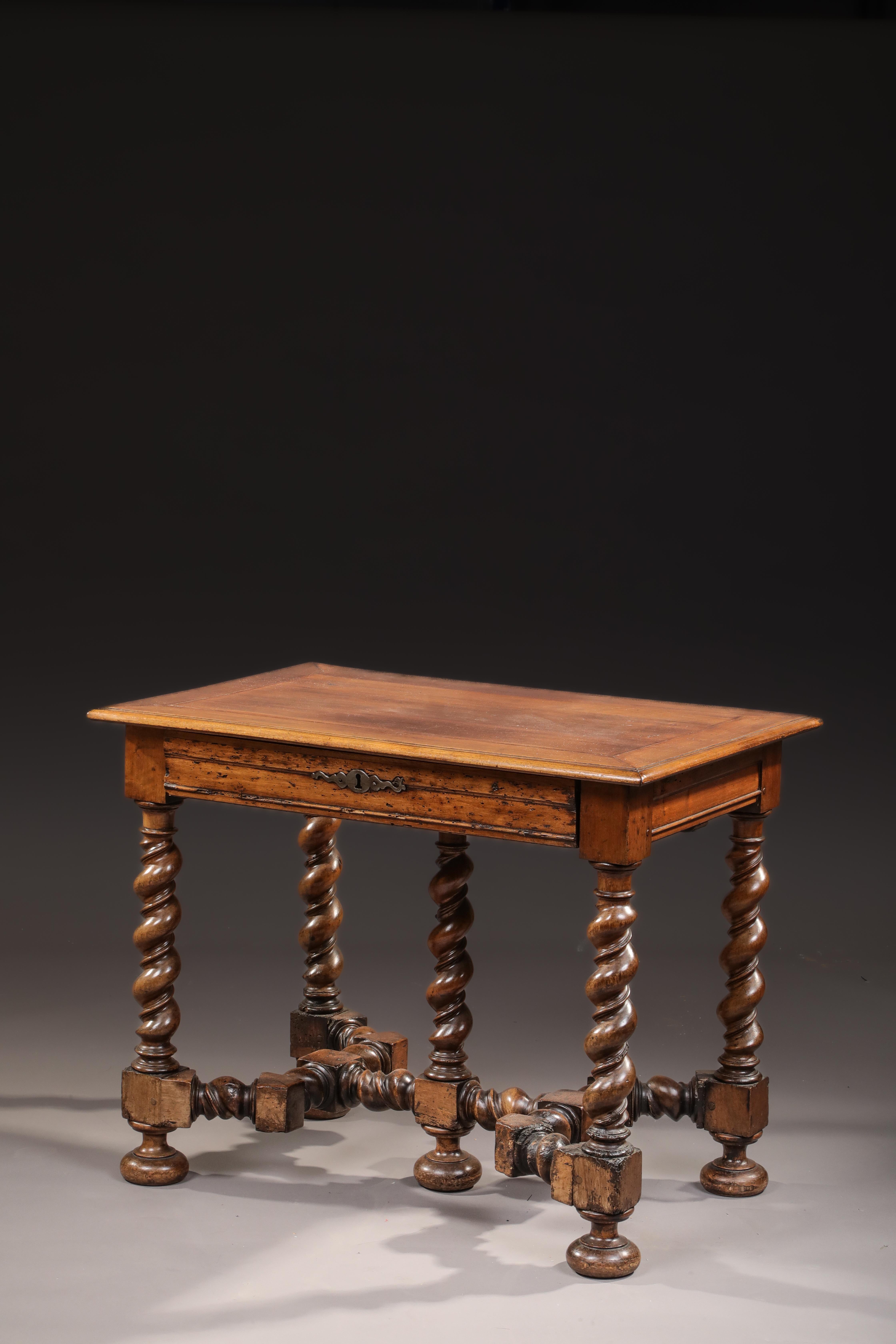 TABLE WITH TWISTED LEGS FROM THE LOUIS XIII PERIOD

ORIGIN: FRANCE
PERIOD: FIRST HALF OF THE 17th CENTURY

Height: 77 cm
Length: 96 cm 
Depth: 63 cm

Walnut wood


This very beautiful table in blond walnut wood, with a dense and tight grain, conveys