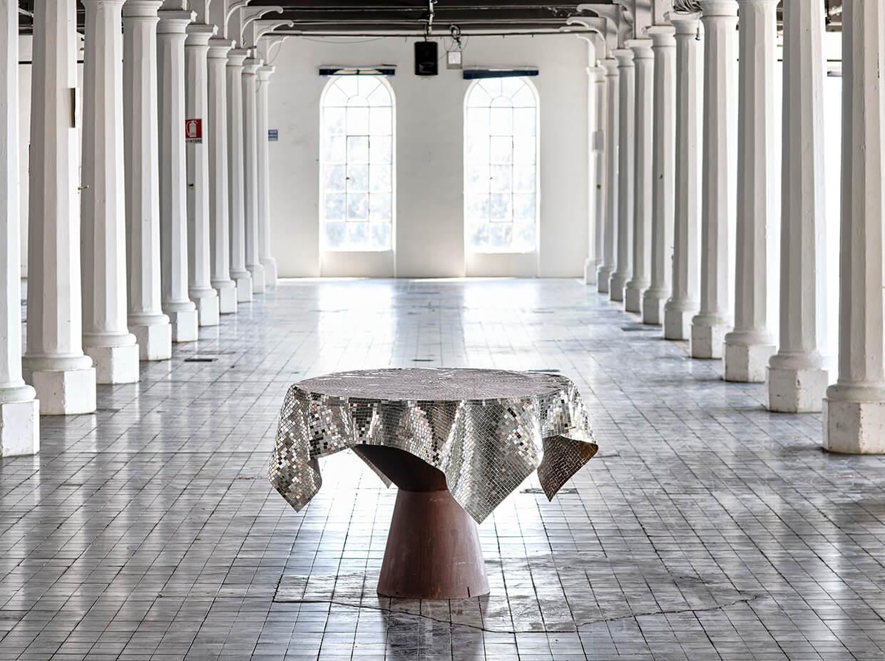 Tablecloth by Davide Medri
Materials: mirror mosaic (silver)
Also available in gold.
Dimensions: H 90 x D 120 cm

Davide Medri was born in Cesena on August 7th 1967 and graduated at the Academy of Fine Arts in Ravenna, the Gino Severini State