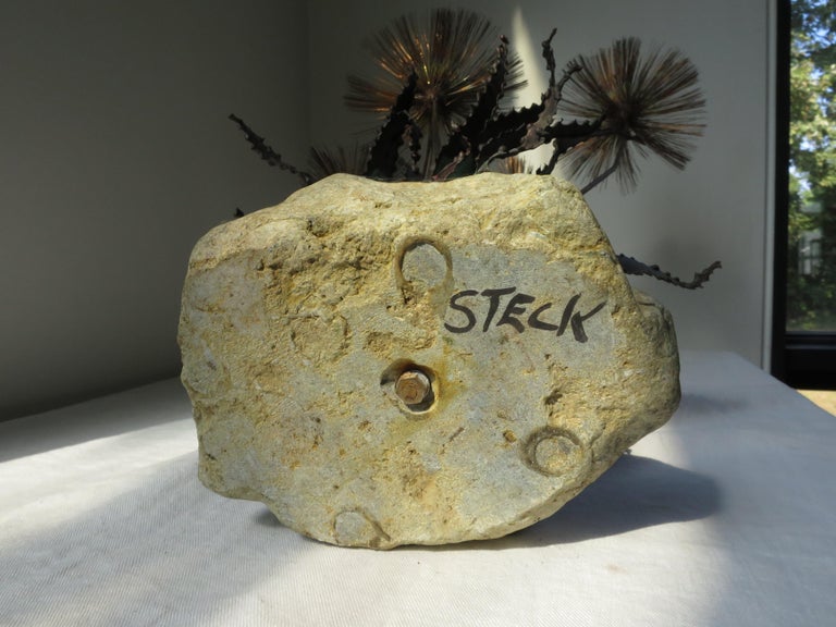 Signed sculpture of copper and stone by John Steck. 
Looks like dandelions! A riff on the French tole plant sculptures...
Also called 
