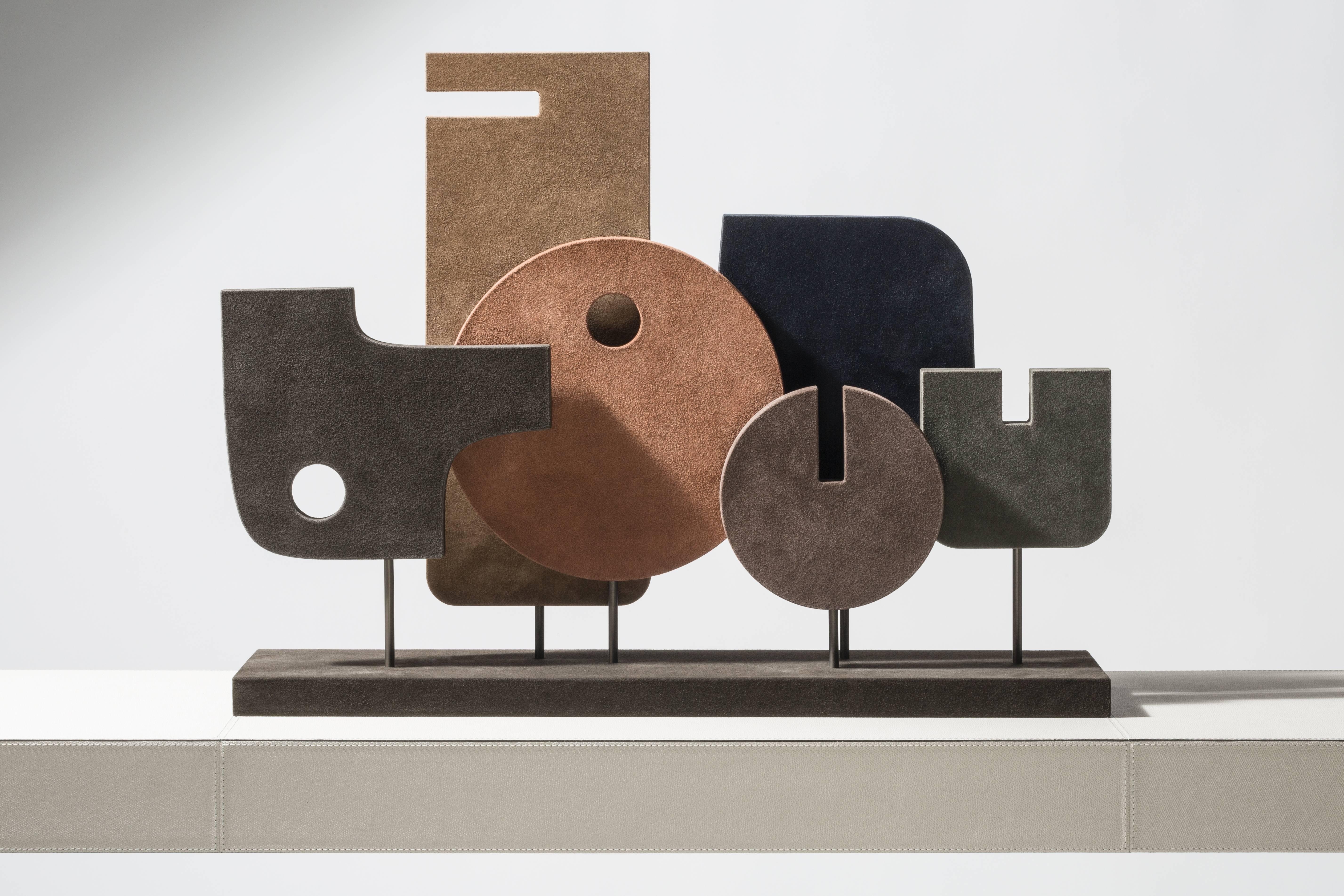 A mix of Space Age design and tribal art, this contemporary totem is a great decorative piece able to create a connection between abstraction and figuration. Made of wood covered is suede with bronze rods.

Giobagnara:
A brand that is distinctive