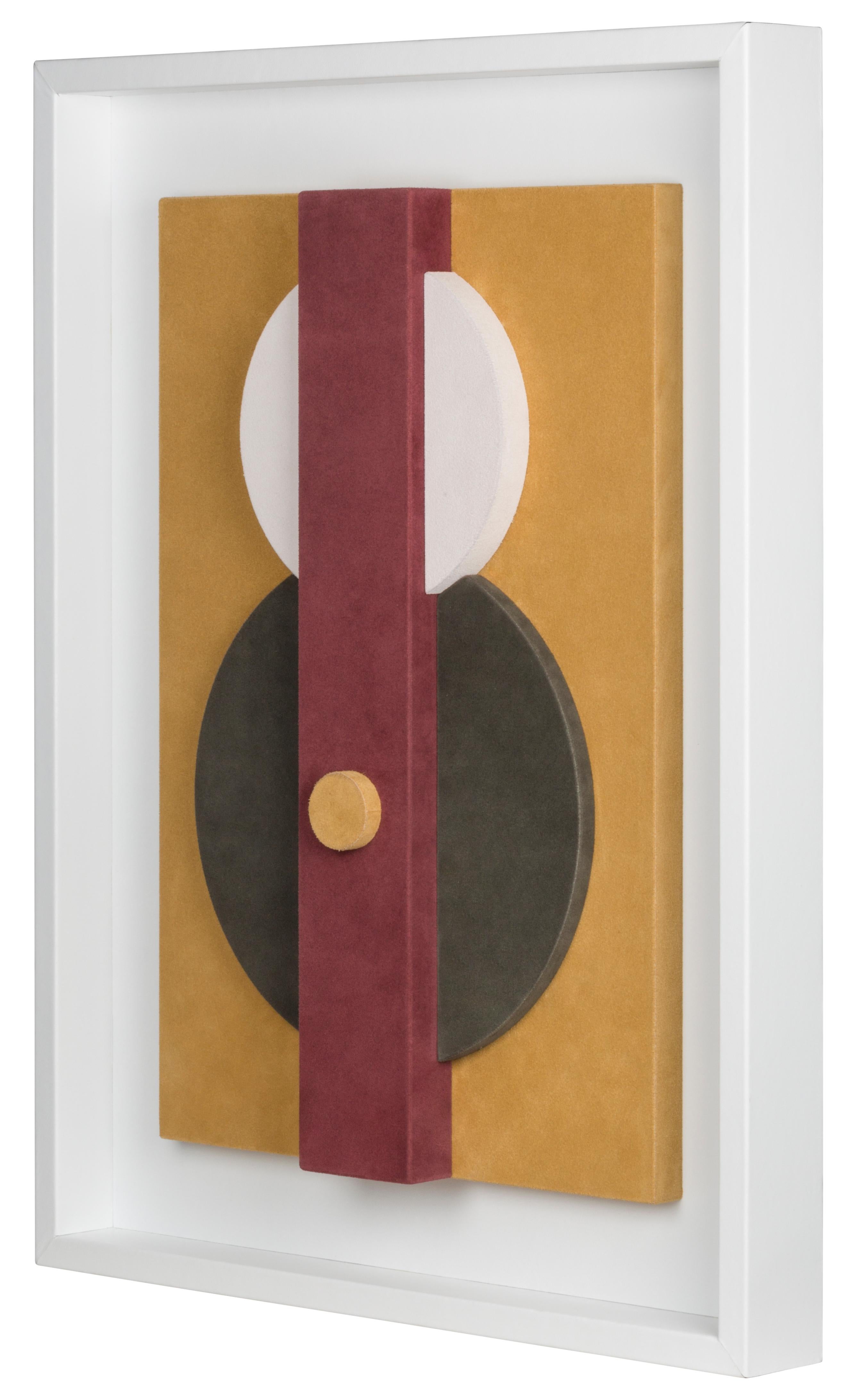 This suede-covered wall sculpture is framed in white nappa.
The interaction between colors and shapes makes it a decorative piece based on pure geometry, where abstraction and figuration create formal structures that allow colour to dominate. This