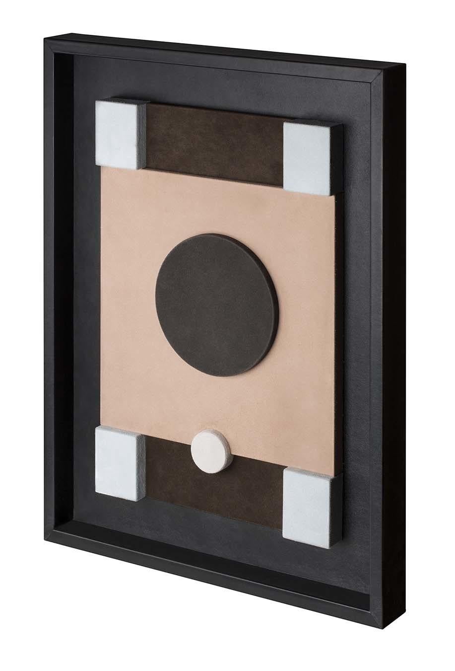 An abstract pattern with simple shapes and a basic color palette stands at the center of this remarkable wall sculpture. Created by GioBagnara as part of a series of decorative pieces entirely fashioned of leather, this piece features a black nappa