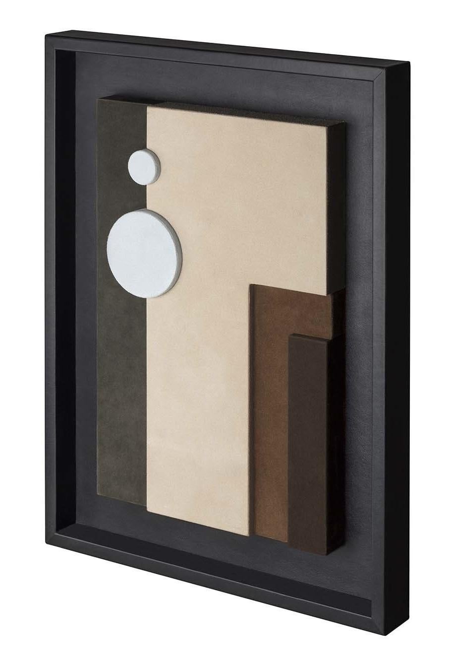 Designed by GioBagnara in a limited series of abstract designs, this superb wall sculpture mixes the smooth texture of the black nappa frame with the soft velvet feel of the suede interior, a unique piece that will become the focal point in any