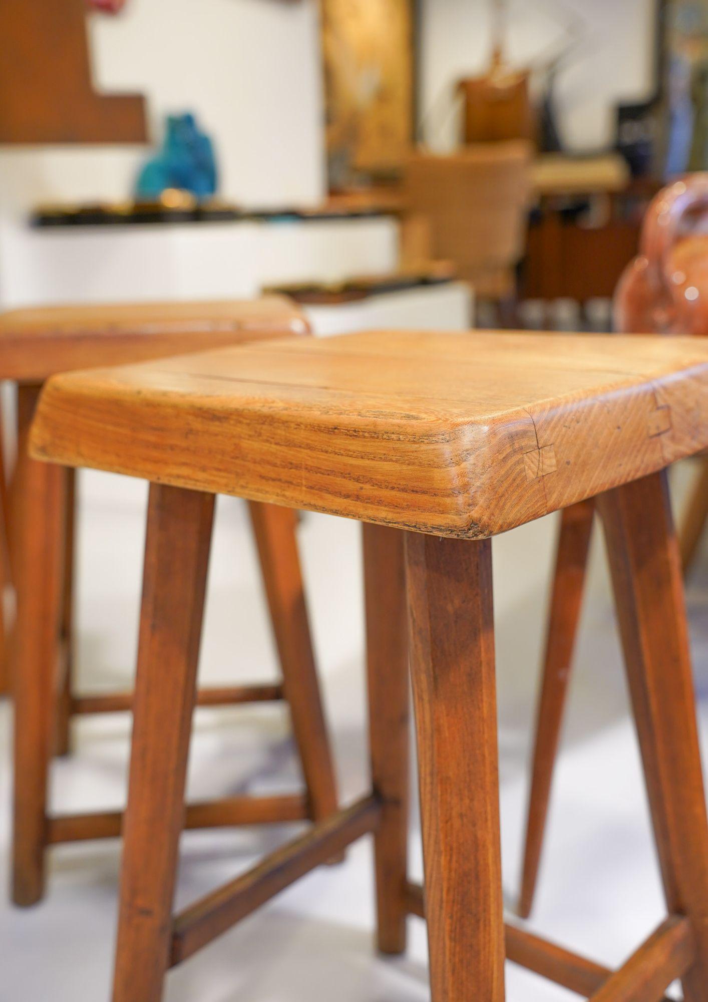 Oak stools by designer Pierre Chapo measuring 54.5 x 31 x 31 cm