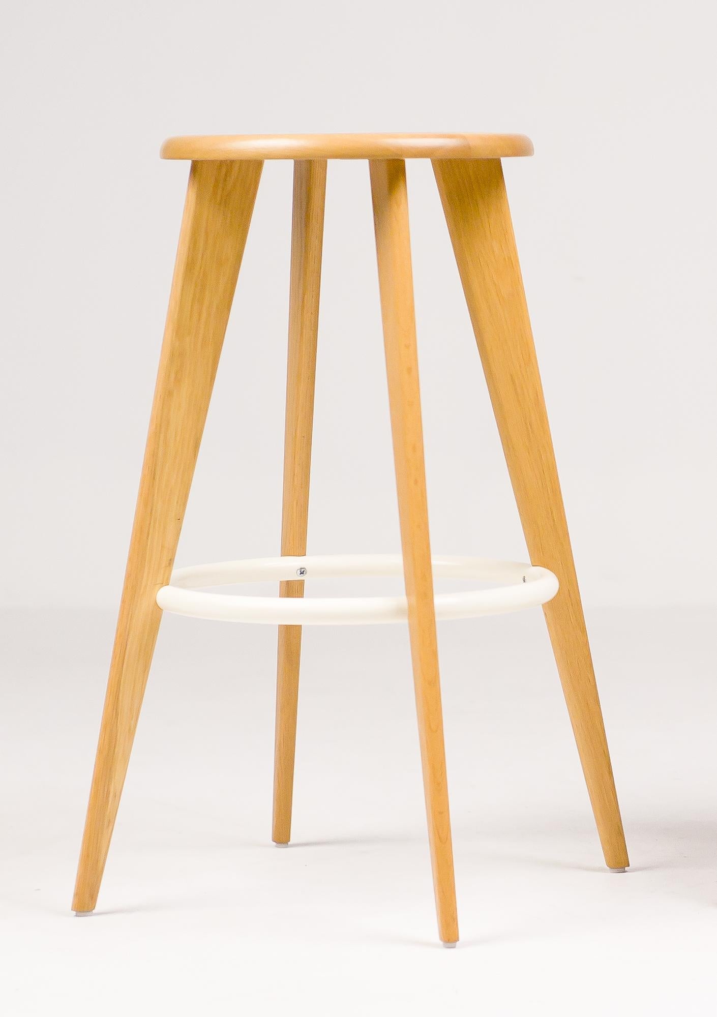 The Tabouret Haut bar stool designed by Jean Prouvé and made by Vitra is based on the basic shape of the Classic bar stool. Crafted from oak conform the classic Tabouret Haut. 
Natural oak, off-white enameled steel ring.
Rare version, no langer in