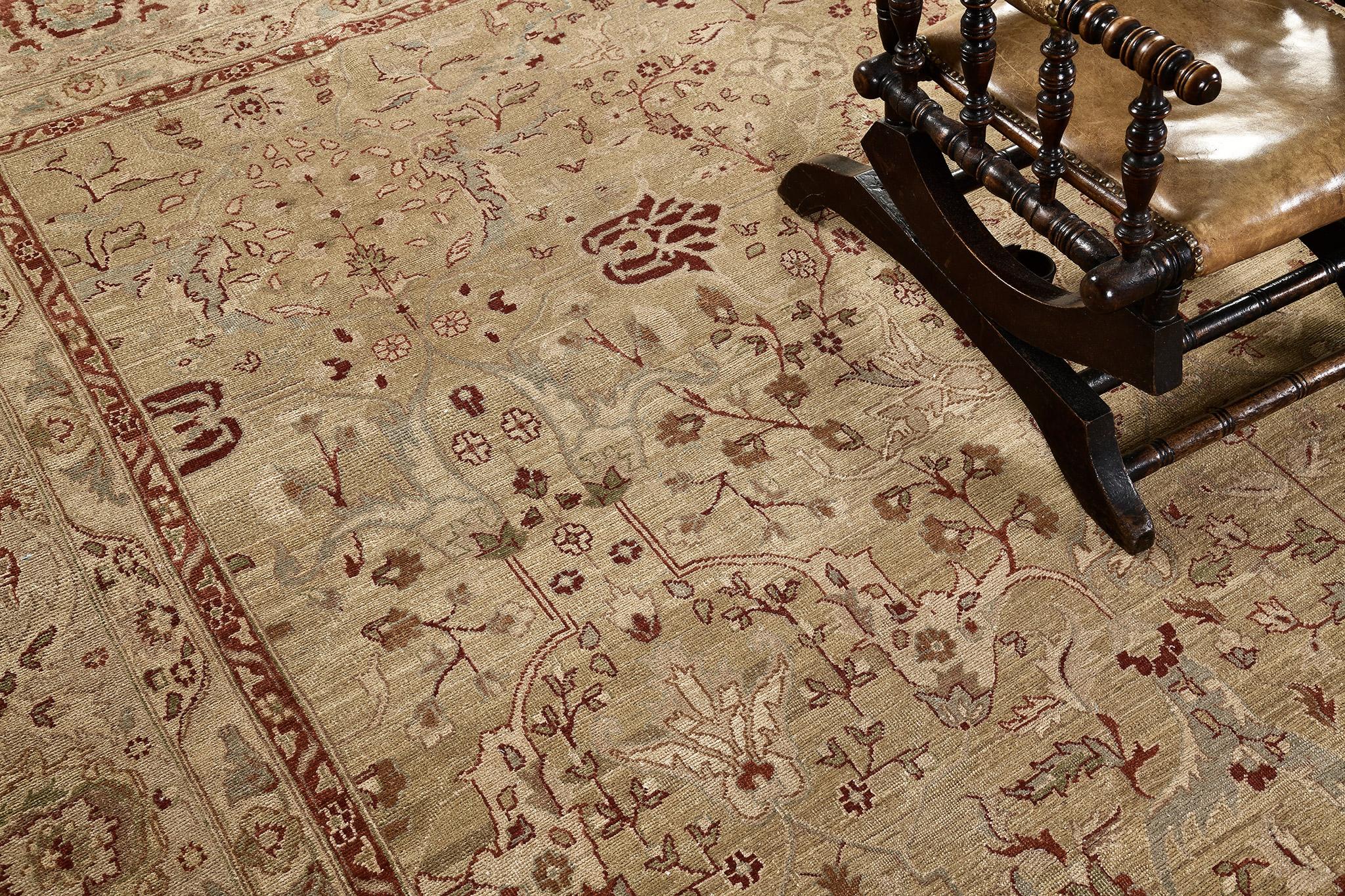 An elegant revival of Tabriz Hadji Jalili rug that gracefully establishes sophistication through the botanical petterns of the blooming palmettes, leafy tendrils and statement rose buds. Flanked by inner and outer floral guard bands, this poised rug