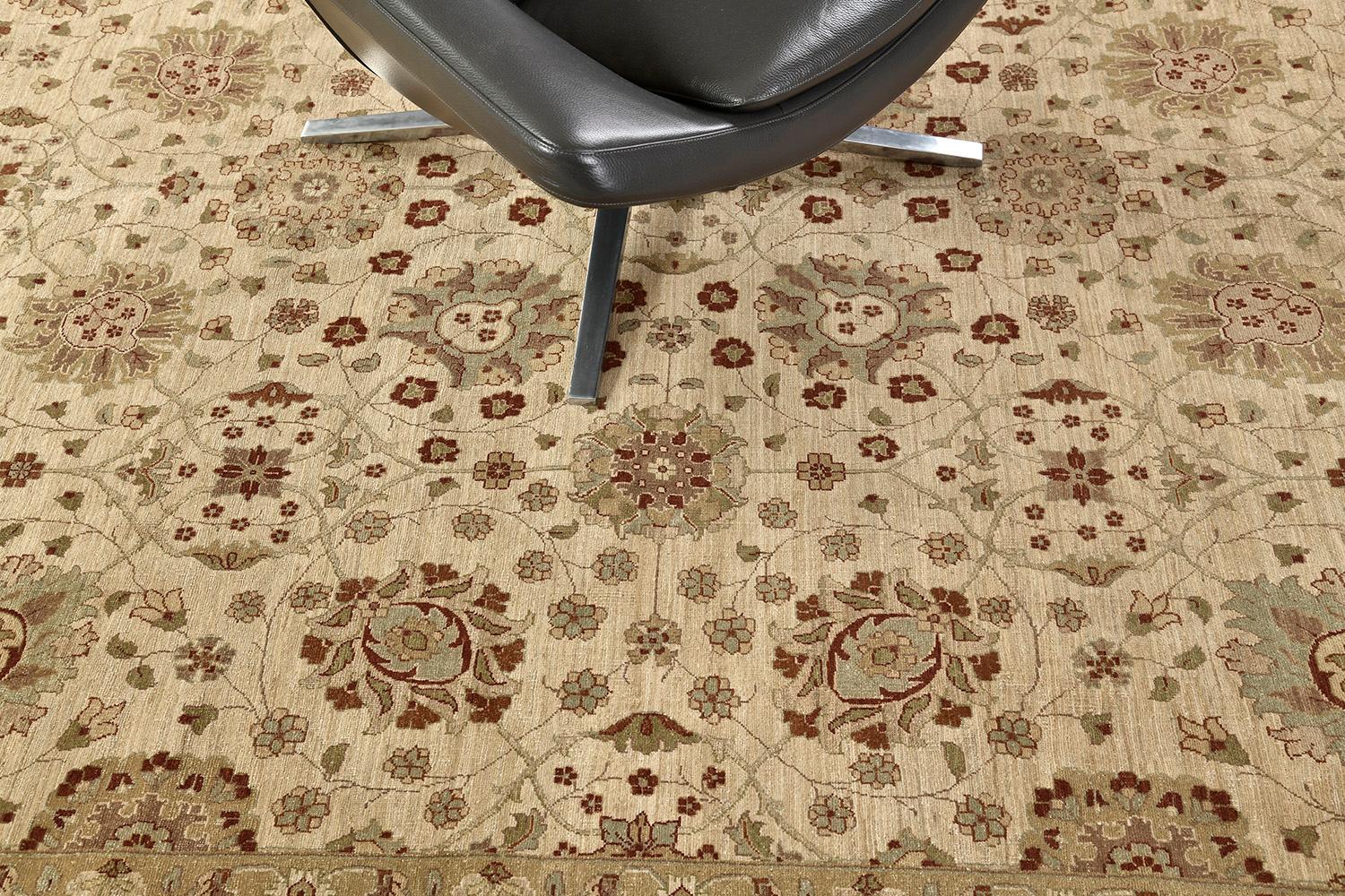 An elegant revival of Hadji Jalili has a neutral ground with cream and tan motifs that are accentuated with walnut-colored outlines. An all-over pattern that has finely rendered motifs of branching vines, palmettes, carnation, and leaf and floral