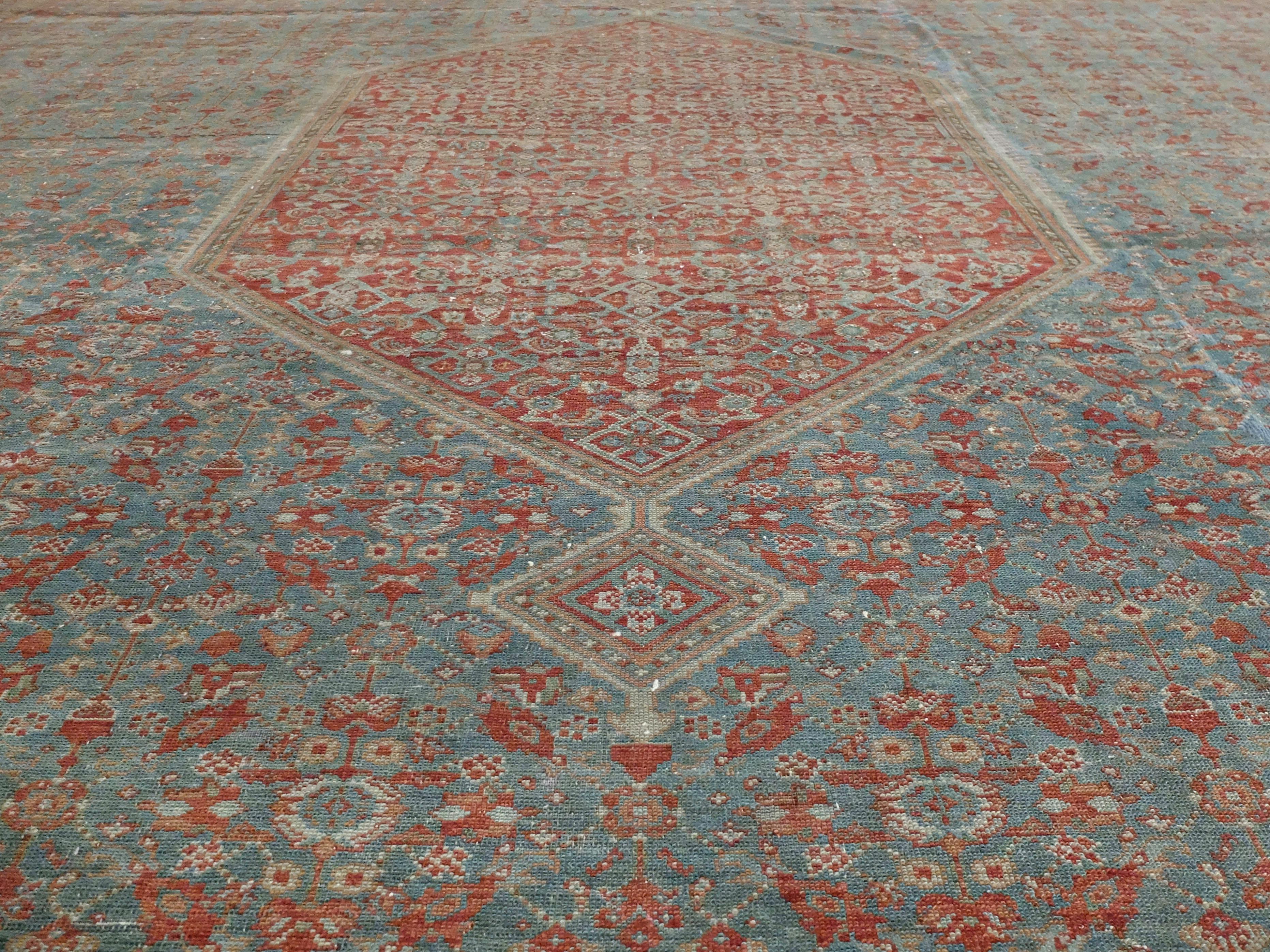 An iconic Tabriz Haji Jalili antique rug made with the highest quality in mind. It has a mimicking small and large diamond which creates its overall structure. Upon closer look, you can see small intricate detail throughout the entire rug. Similar